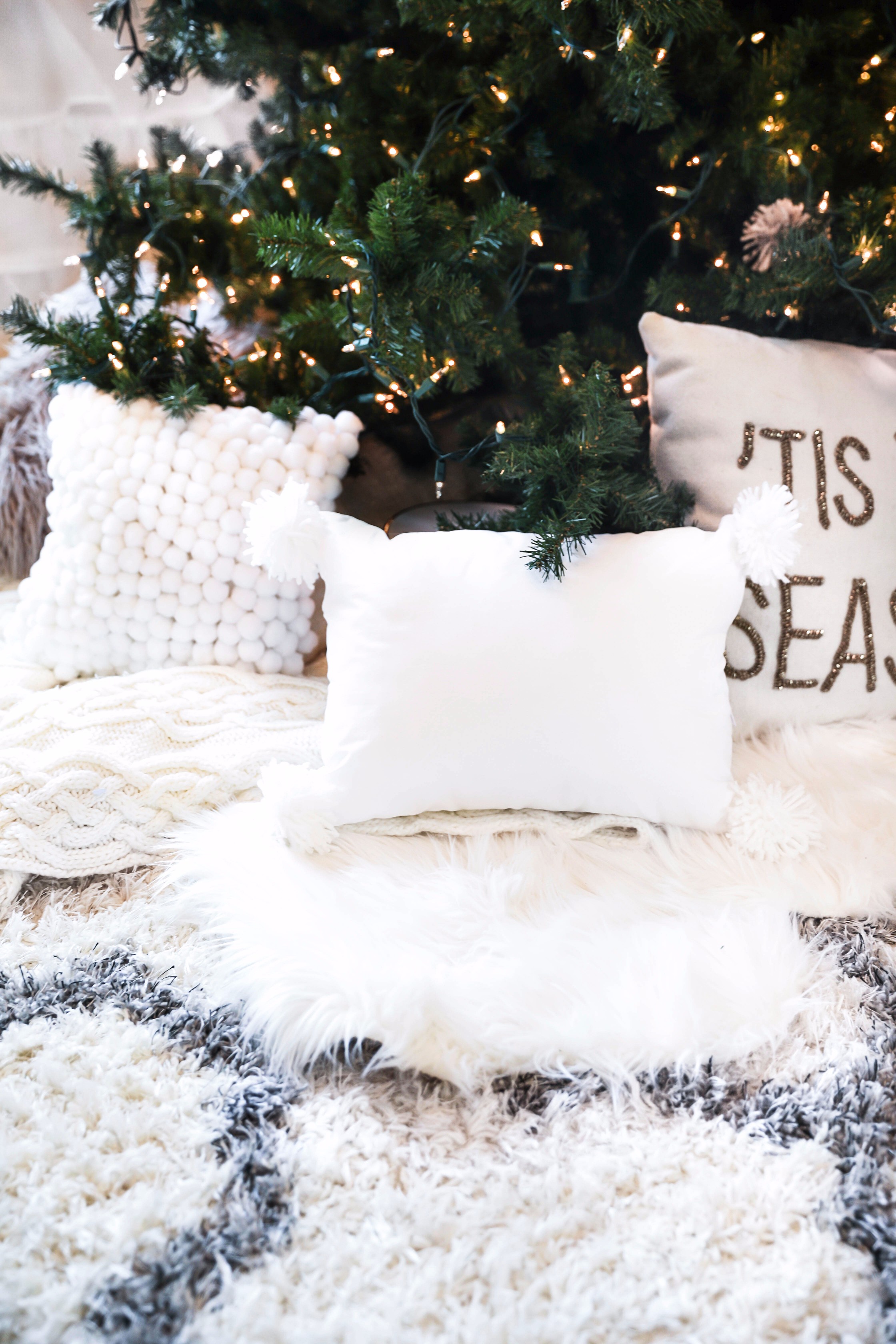 Holiday DIY decor! Learn how to make DIY snowball ornaments, tassel ornaments, pom pom ornaments, pom pom pillows, and pom pom garlands! Details on daily dose of charm lauren lindmark