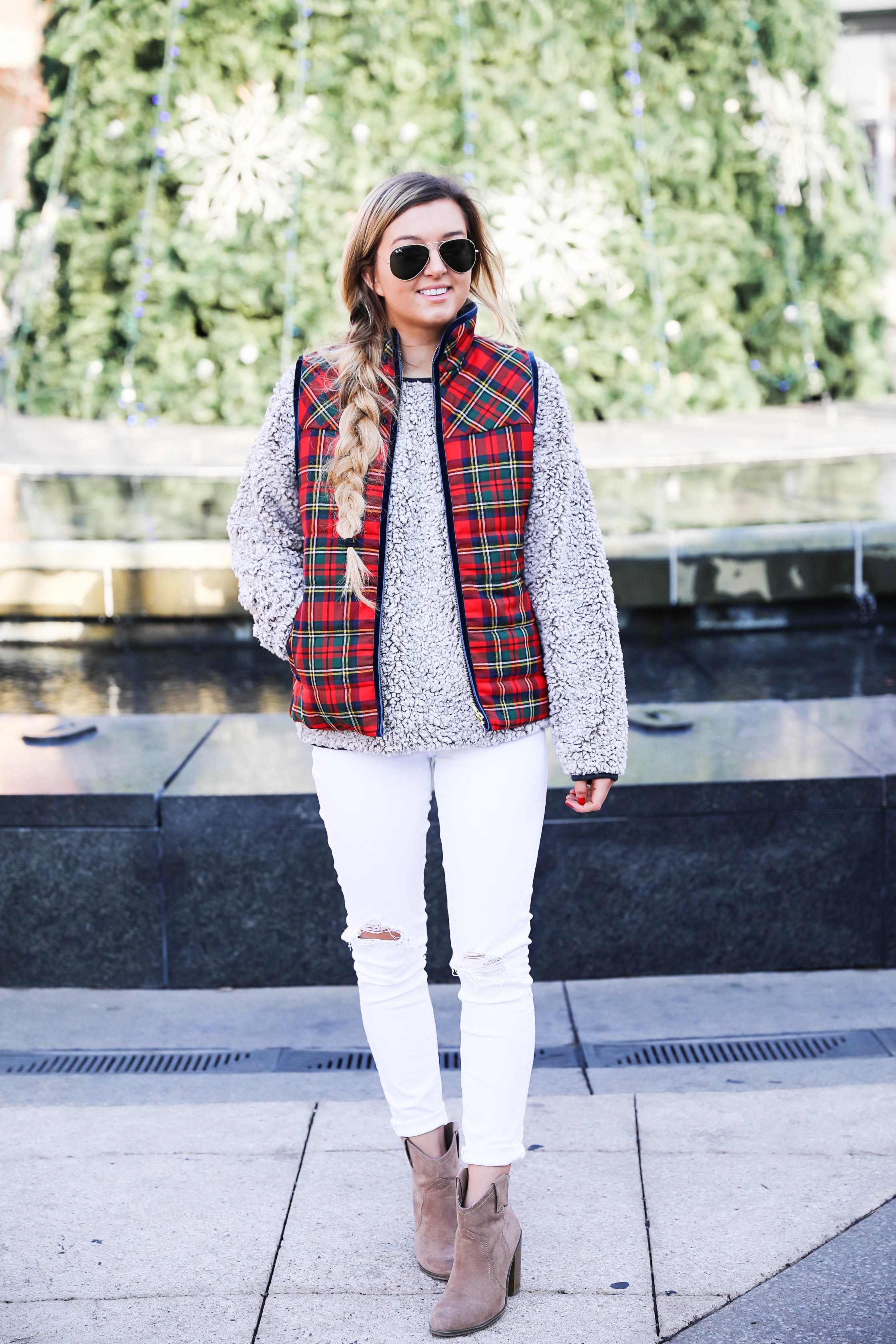 Tartan plaid j.crew vest with Dylan true grit comfy crewneck sweatshirt with white ripped jeans and side braid with long hair. Find the details for this winter outfit on fashion blog daily dose of charm by lauren Lindmark 