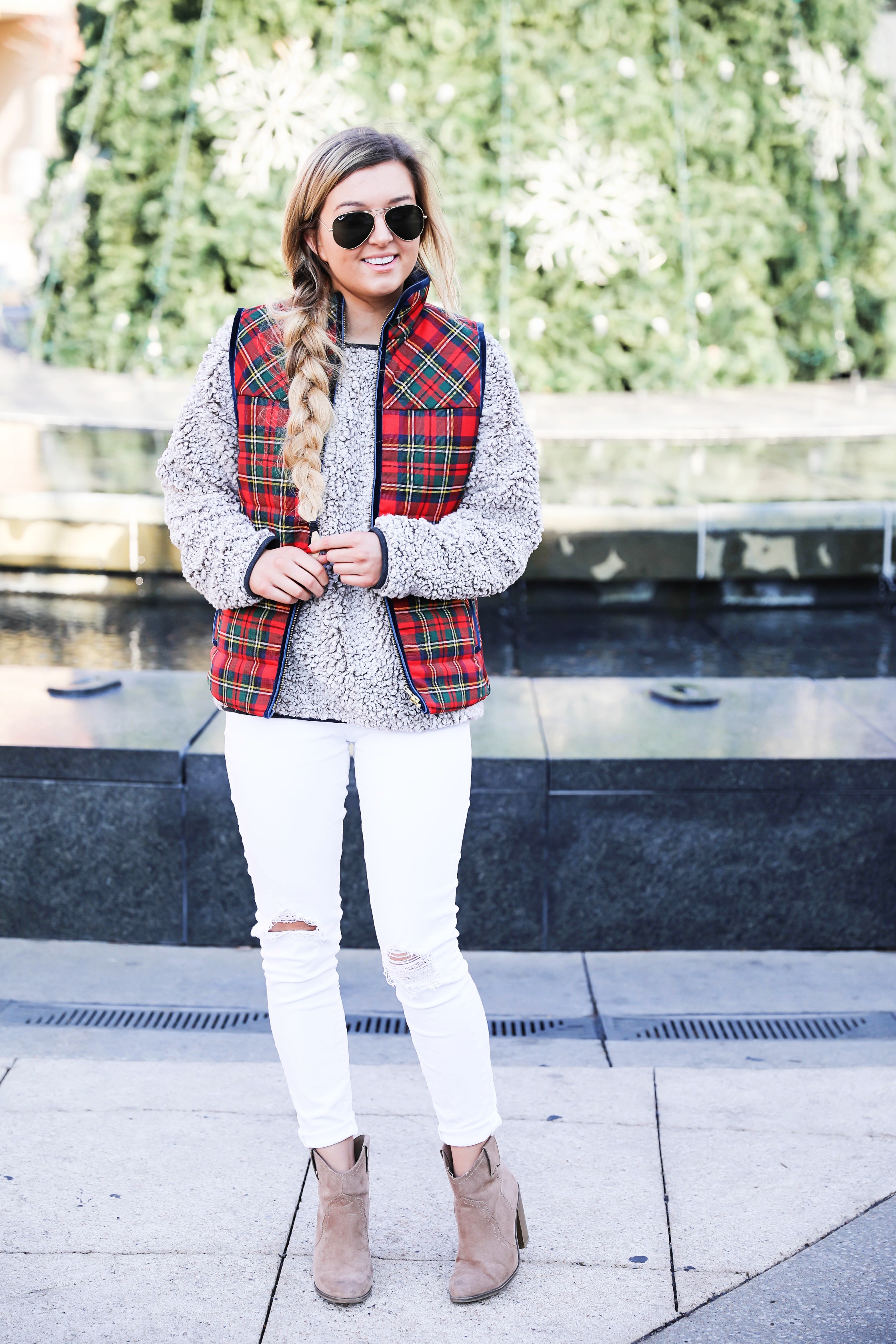 Tartan plaid j.crew vest with Dylan true grit comfy crewneck sweatshirt with white ripped jeans and side braid with long hair. Find the details for this winter outfit on fashion blog daily dose of charm by lauren Lindmark 