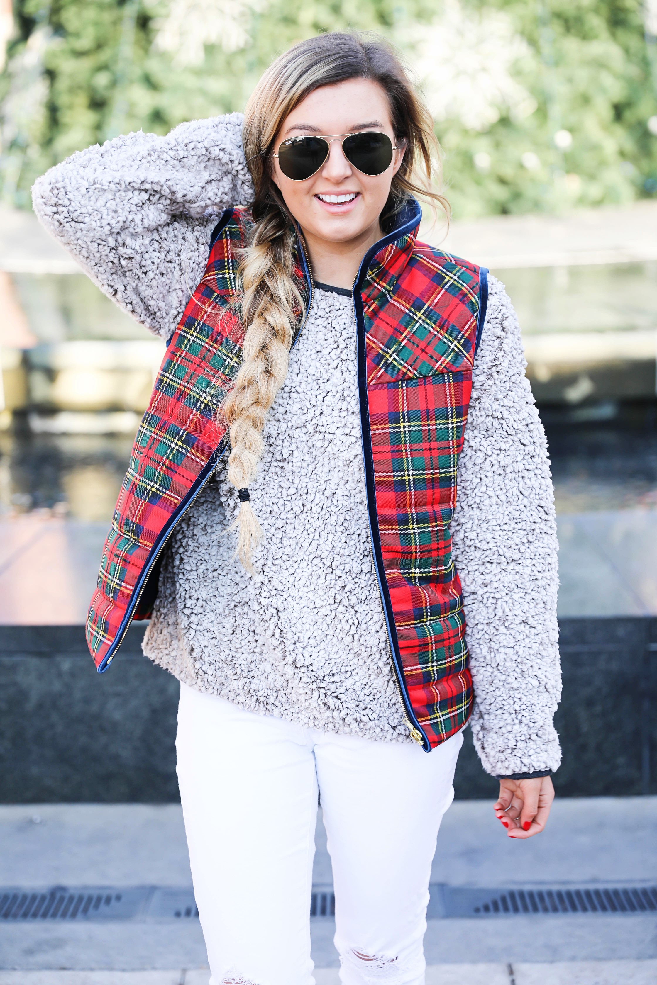 Tartan plaid j.crew vest with Dylan true grit comfy crewneck sweatshirt with white ripped jeans and side braid with long hair. Find the details for this winter outfit on fashion blog daily dose of charm by lauren Lindmark 