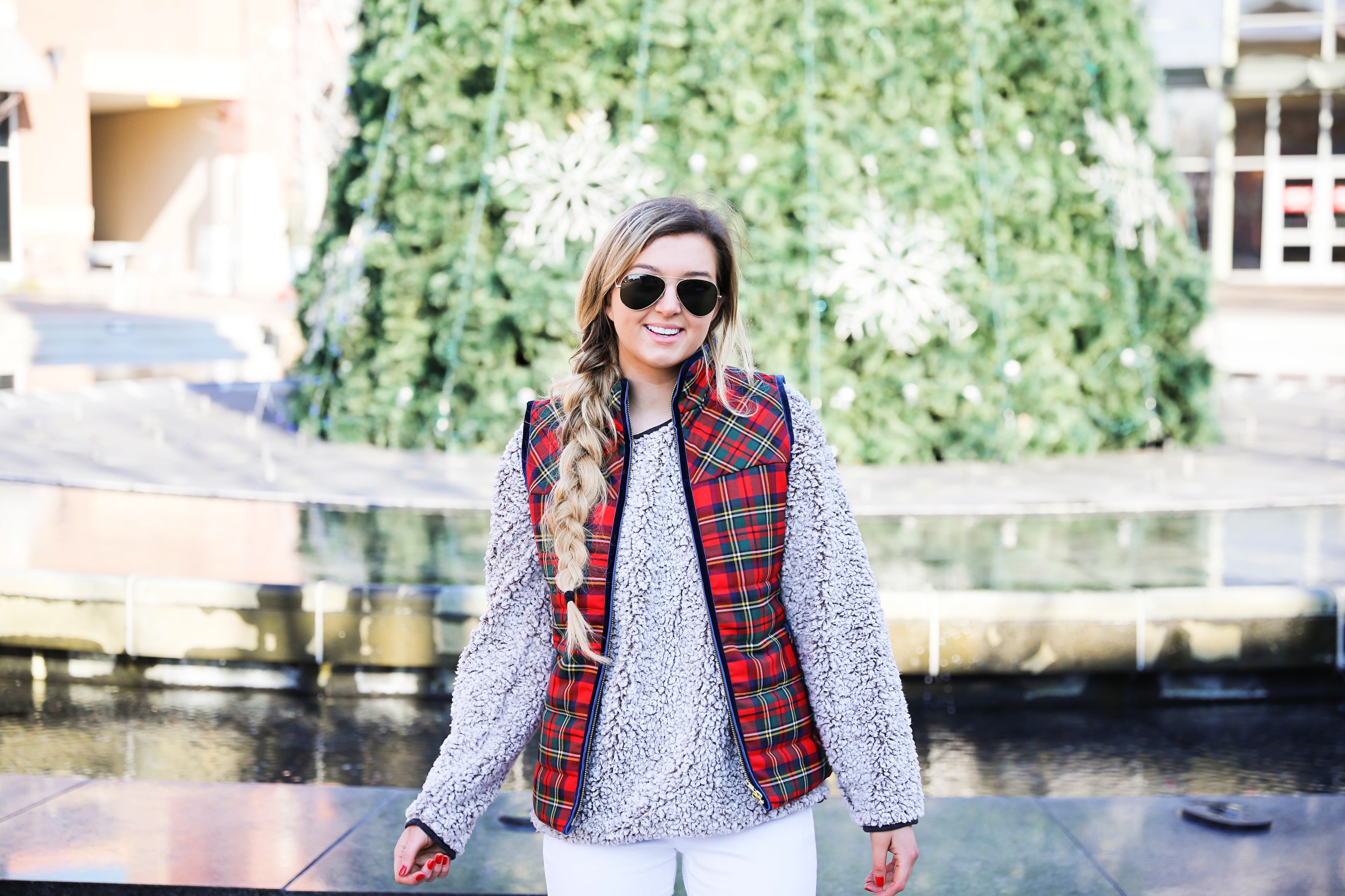 Tartan plaid j.crew vest with Dylan true grit comfy crewneck sweatshirt with white ripped jeans and side braid with long hair. Find the details for this winter outfit on fashion blog daily dose of charm by lauren Lindmark