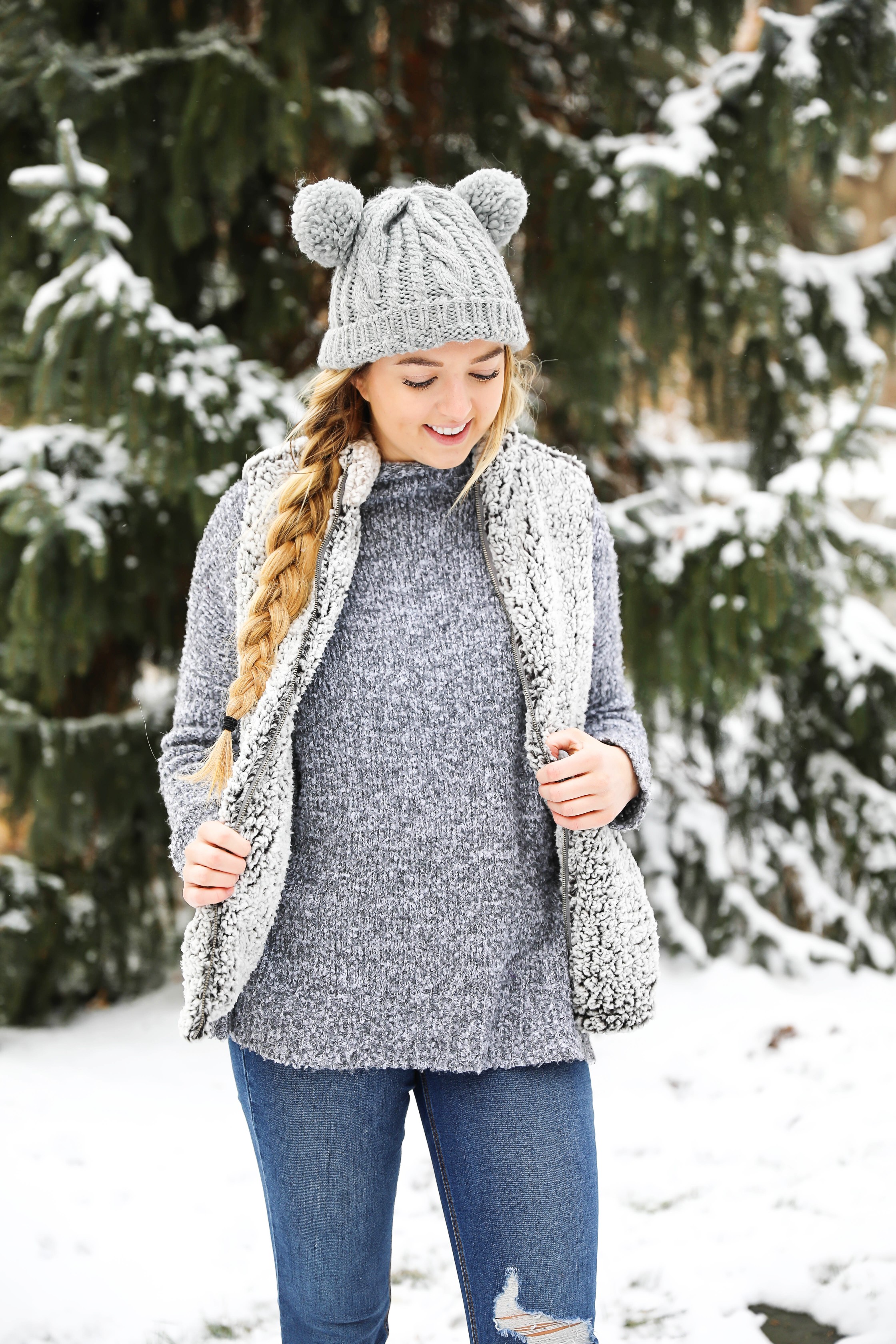 This sherpa vest is the coziest thing I own! I paired it with this soft grey sweater that has a cute turtleneck. I am also wearing my grey pom pom beanie! It has two pom poms which is super cute! I love this winter outfit! Details on fashion blog daily dose of charm by lauren lindmark