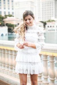 Bellagio fountains in Las Vegas! Wearing a white lace dress and scarf in my pony tail! Las Vegas style! Las vegas blogger! Details on daily dose of charm by lauren lindmark