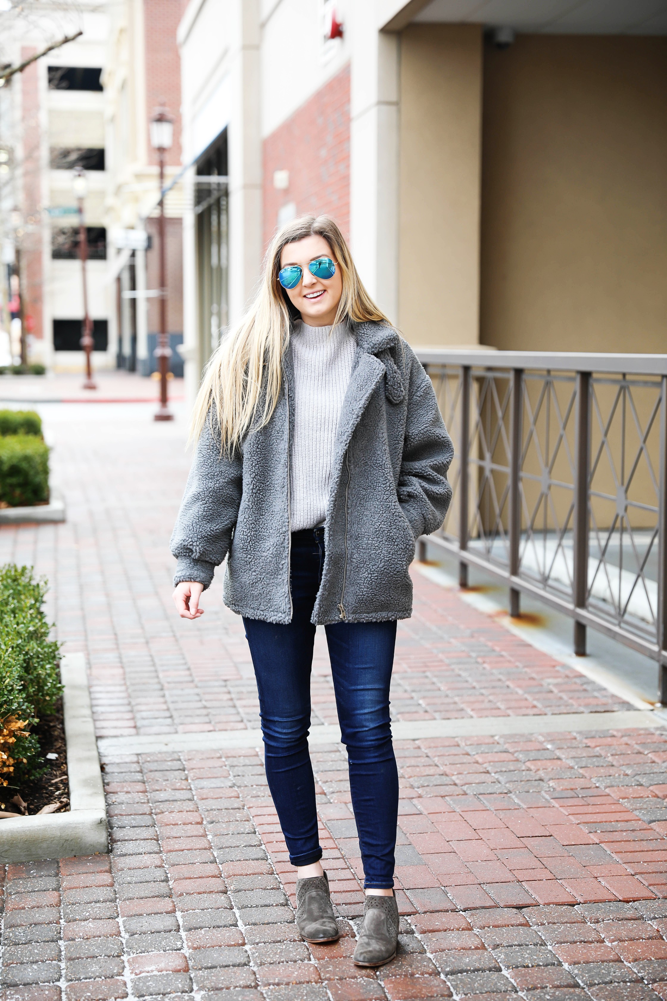 Fuzzy grey aviator coat! Paired this soft jacket with my favorite ray ban blue mirrored aviators! Details on fashion blog daily dose of charm by lauren lindmark