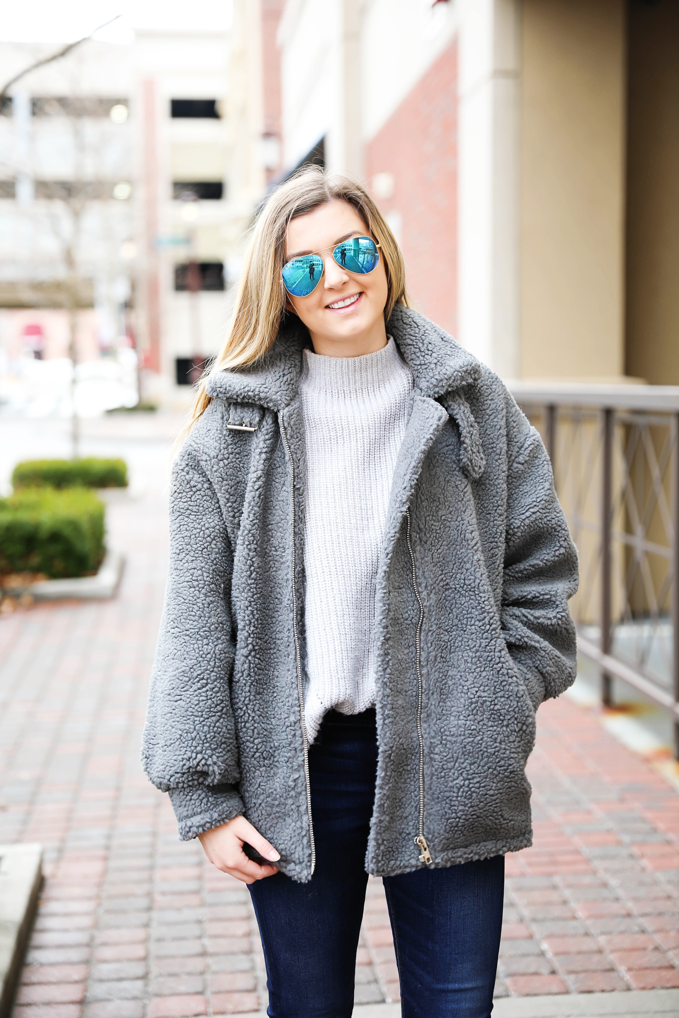 Fuzzy grey aviator coat! Paired this soft jacket with my favorite ray ban blue mirrored aviators! Details on fashion blog daily dose of charm by lauren lindmark
