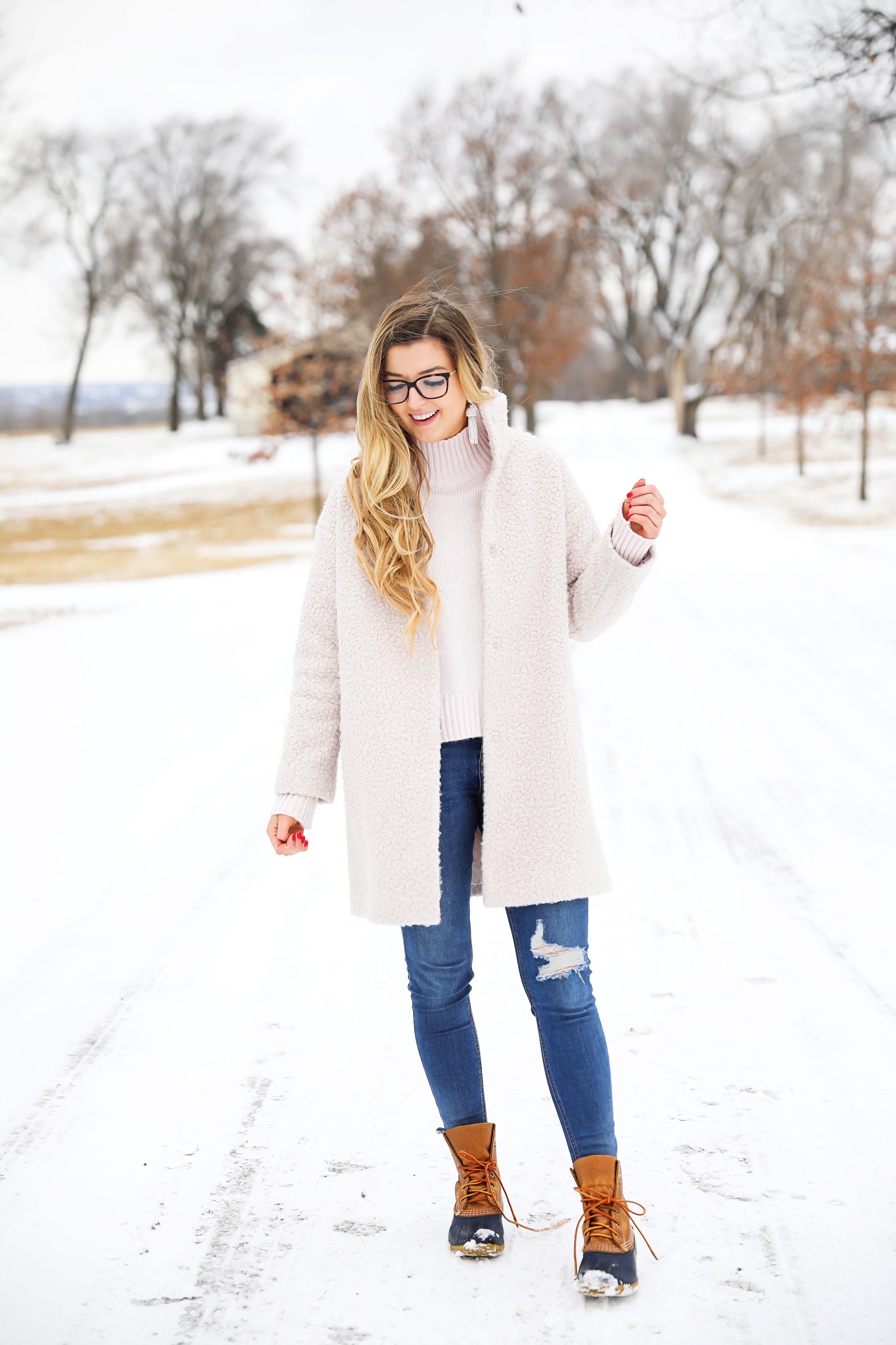 Nice winter coat! Winter coat roundup on the blog! I love this pink coat, it is sort of off white looking! Details on fashion blog daily dose of charm by lauren lindmark