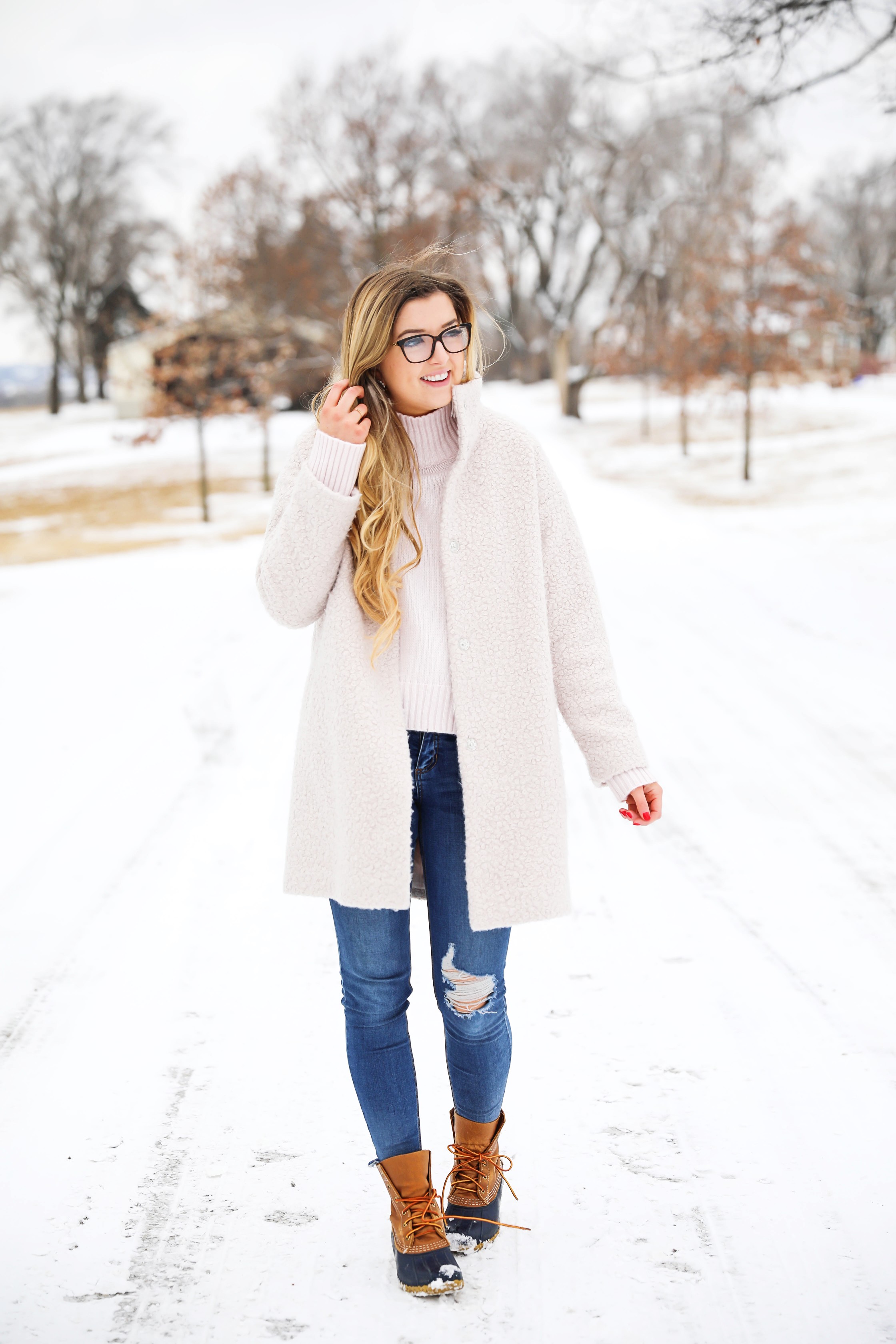 Nice winter coat! Winter coat roundup on the blog! I love this pink coat, it is sort of off white looking! Details on fashion blog daily dose of charm by lauren lindmark