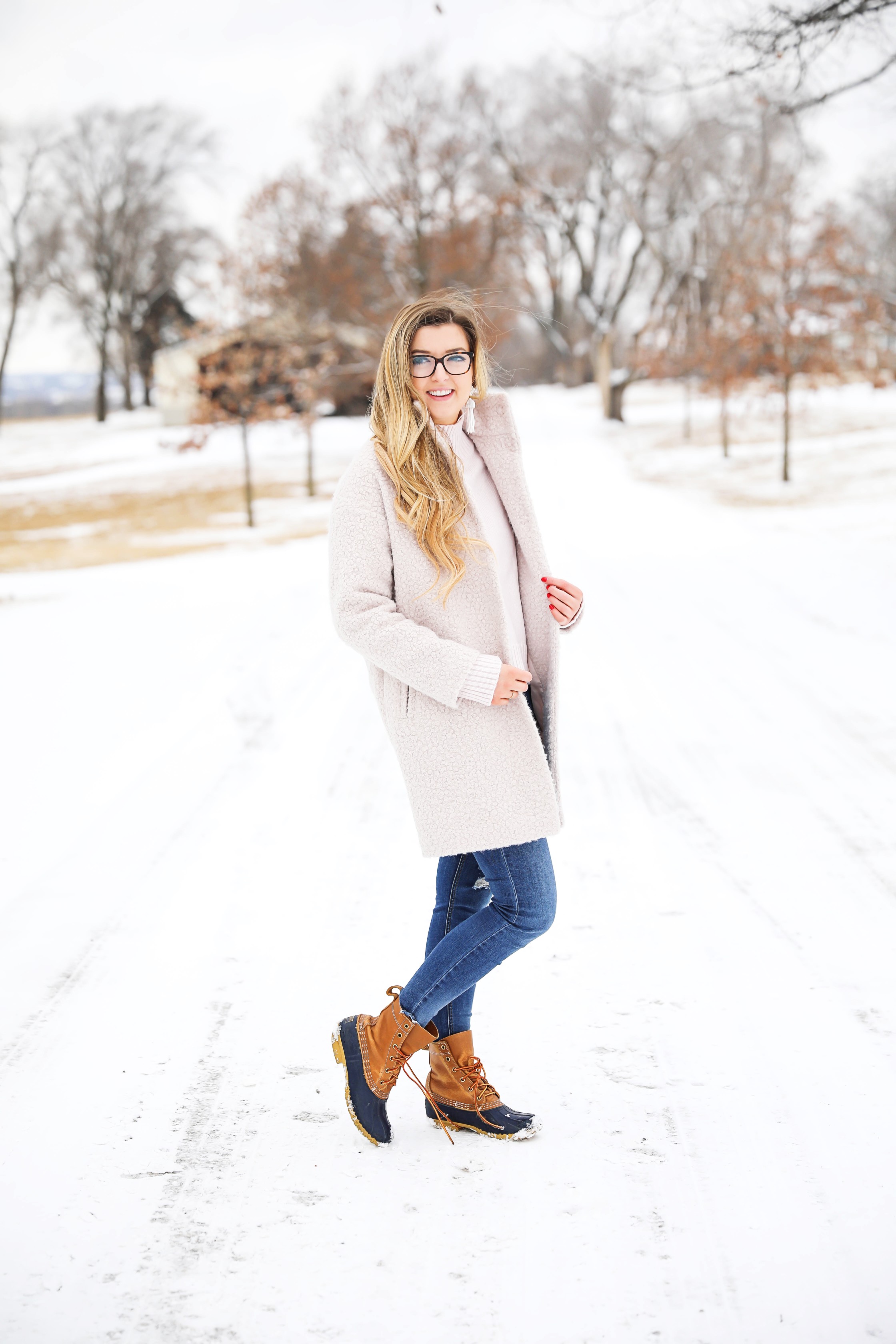 Nice winter coat! Winter coat roundup on the blog! I love this pink coat, it is sort of off white looking! Details on fashion blog daily dose of charm by lauren lindmark