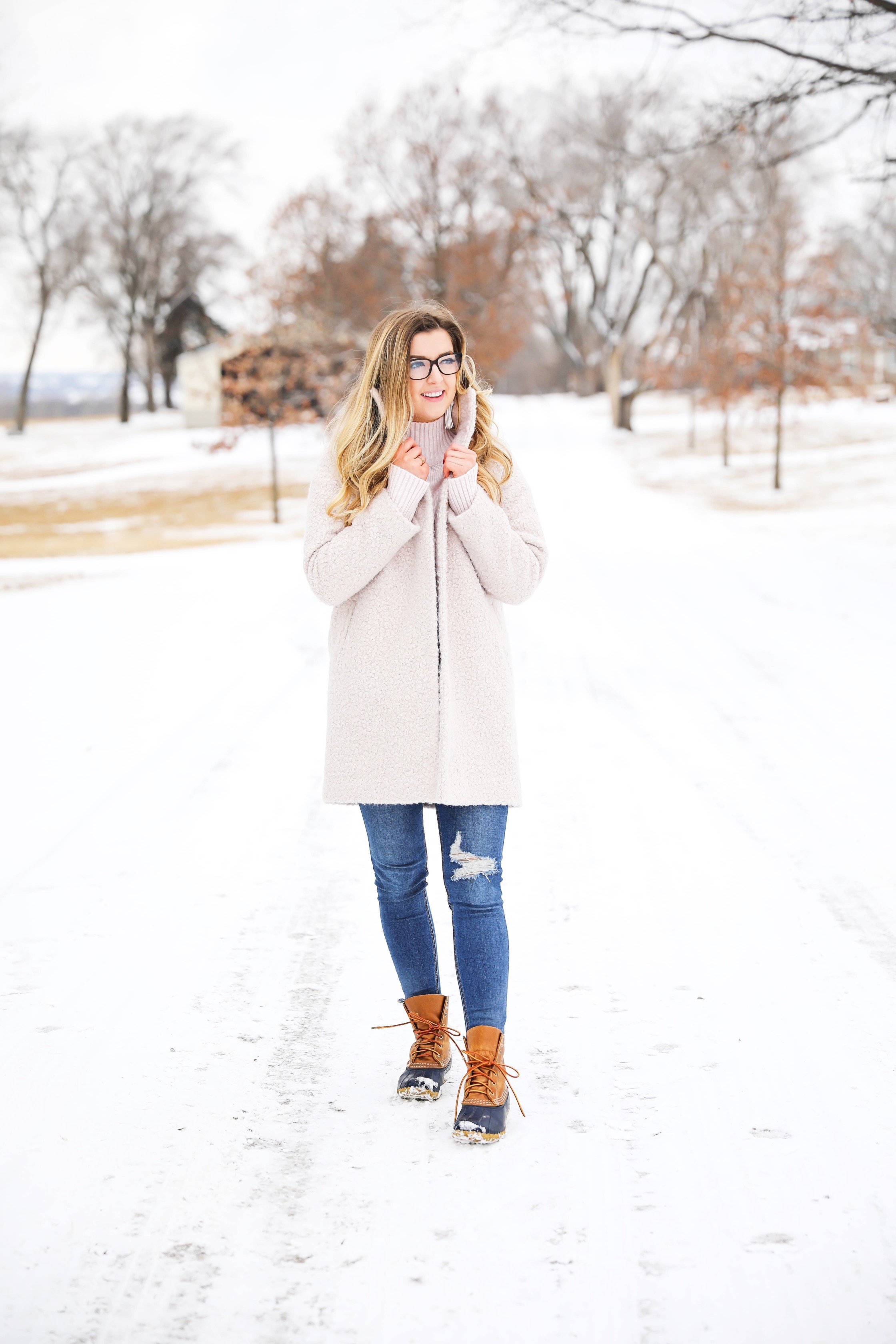 Nice winter coat! Winter coat roundup on the blog! I love this pink coat, it is sort of off white looking! Details on fashion blog daily dose of charm by lauren lindmark