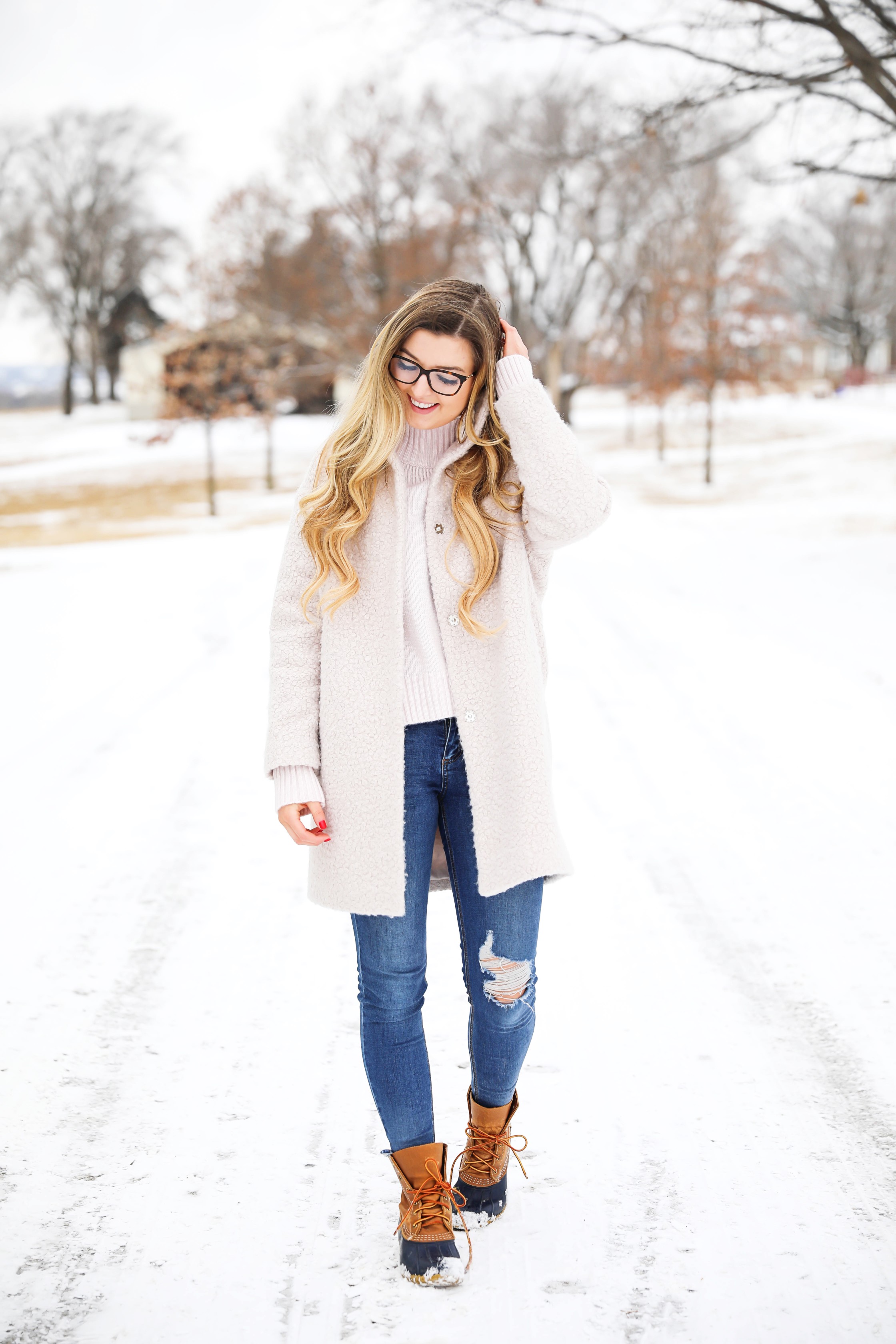 Nice winter coat! Winter coat roundup on the blog! I love this pink coat, it is sort of off white looking! Details on fashion blog daily dose of charm by lauren lindmark