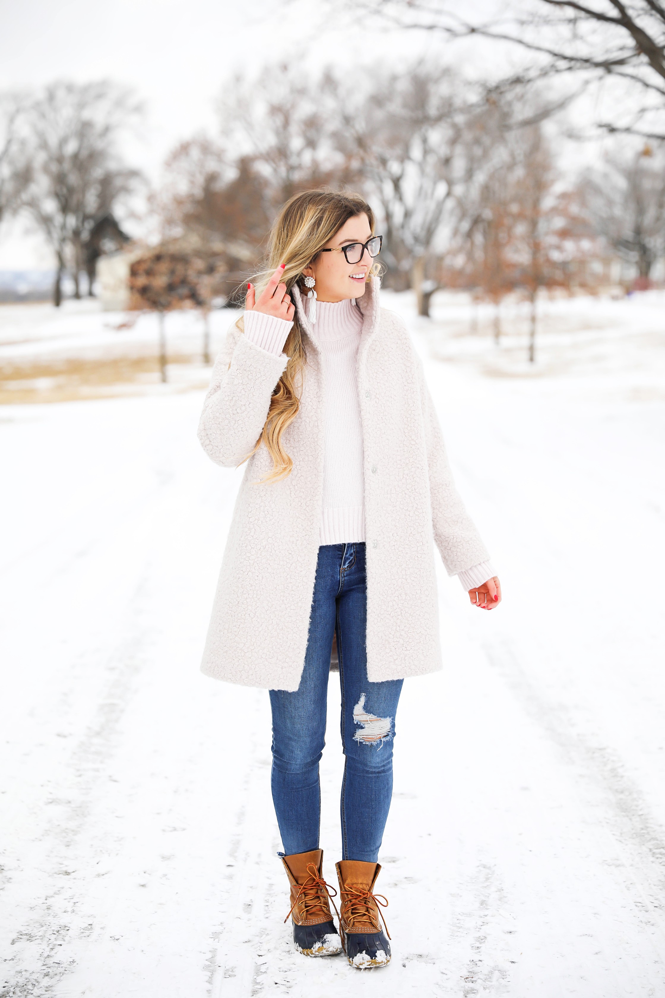 Nice winter coat! Winter coat roundup on the blog! I love this pink coat, it is sort of off white looking! Details on fashion blog daily dose of charm by lauren lindmark