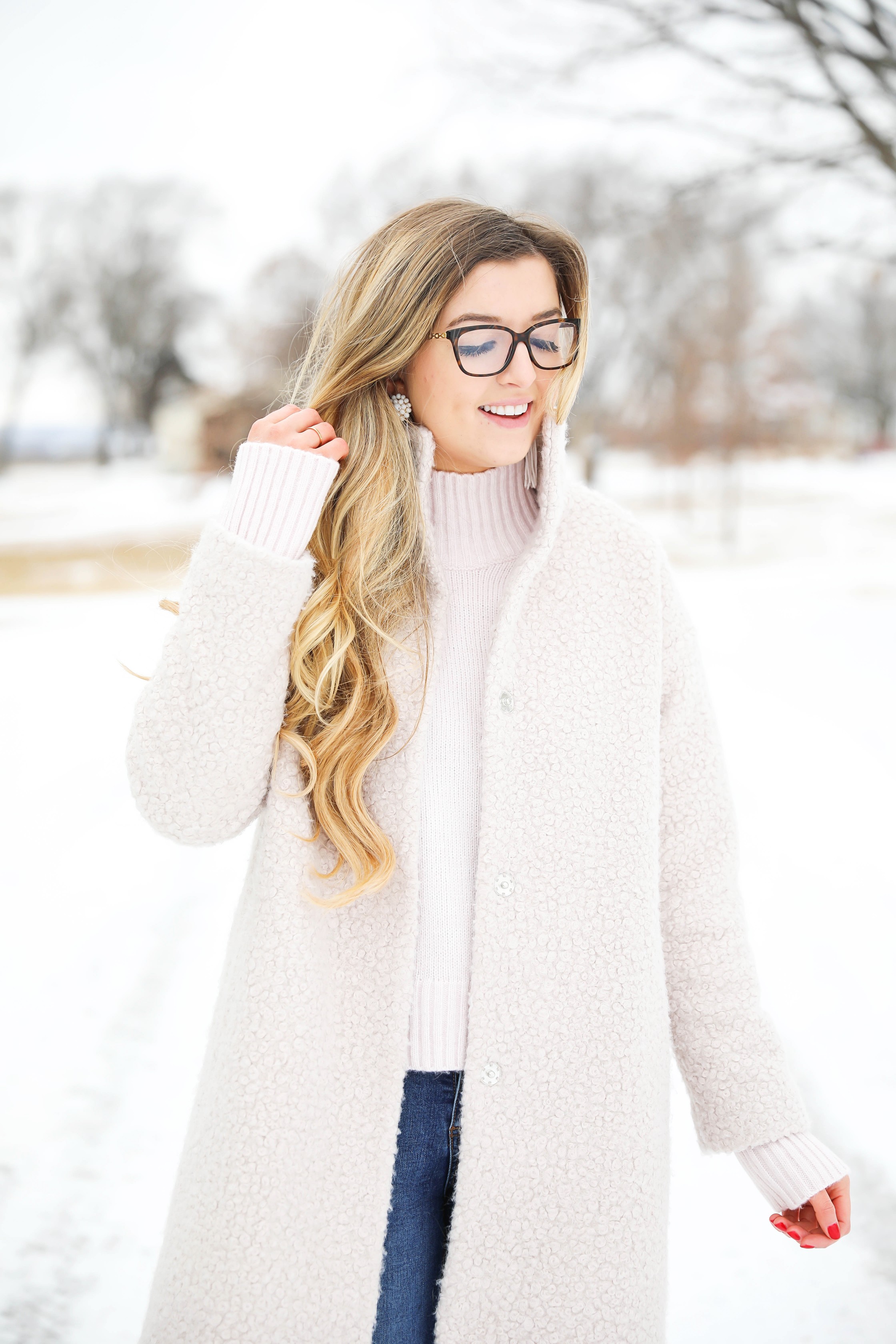 Nice winter coat! Winter coat roundup on the blog! I love this pink coat, it is sort of off white looking! Details on fashion blog daily dose of charm by lauren lindmark