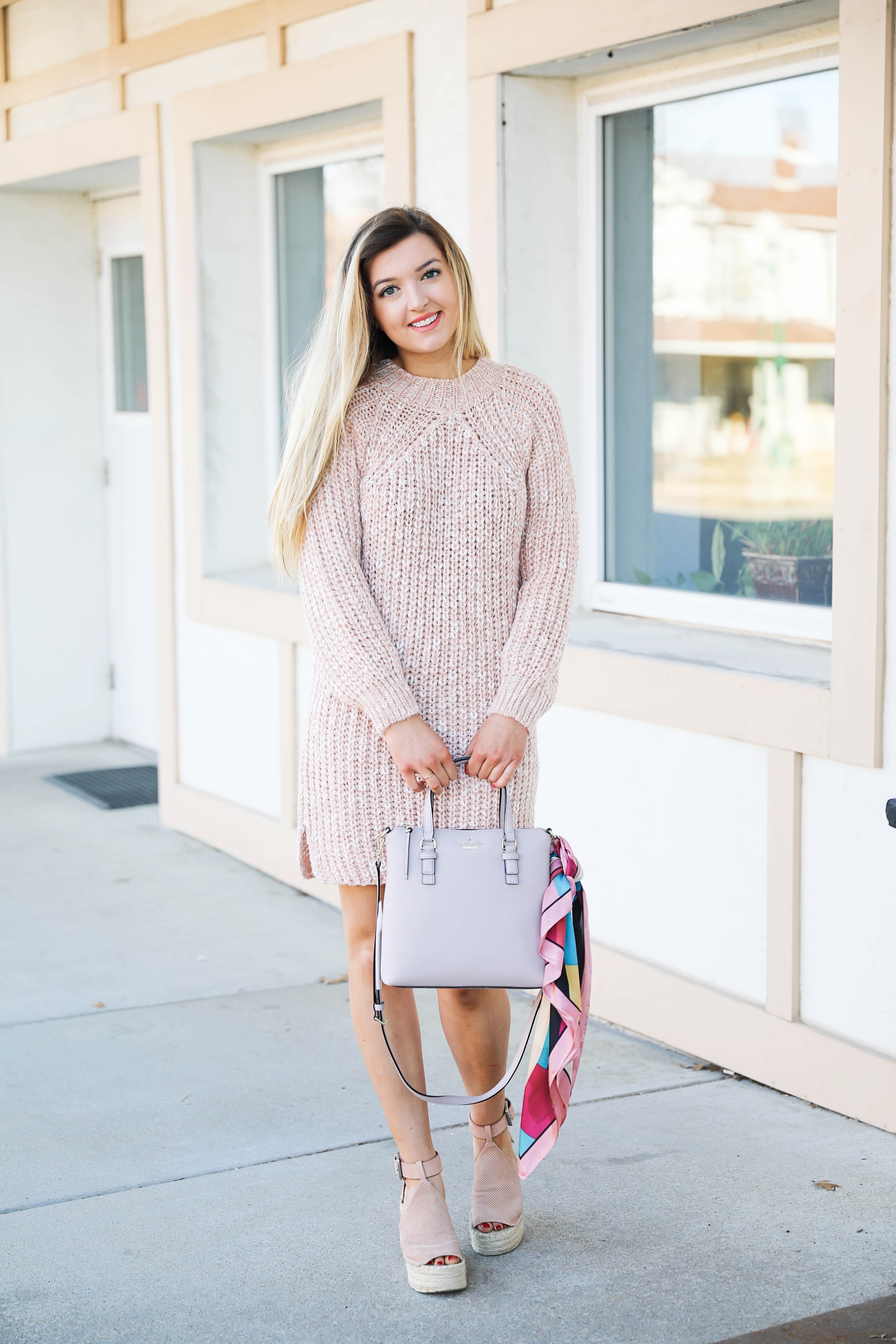 Pink sweater dress with kate spade bag! I love this Kate Spade bag with the pink scarf tied on it! It really adds some cute feminine flair! My new favorite purse! Details on fashion blog daily dose of charm by lauren lindmark