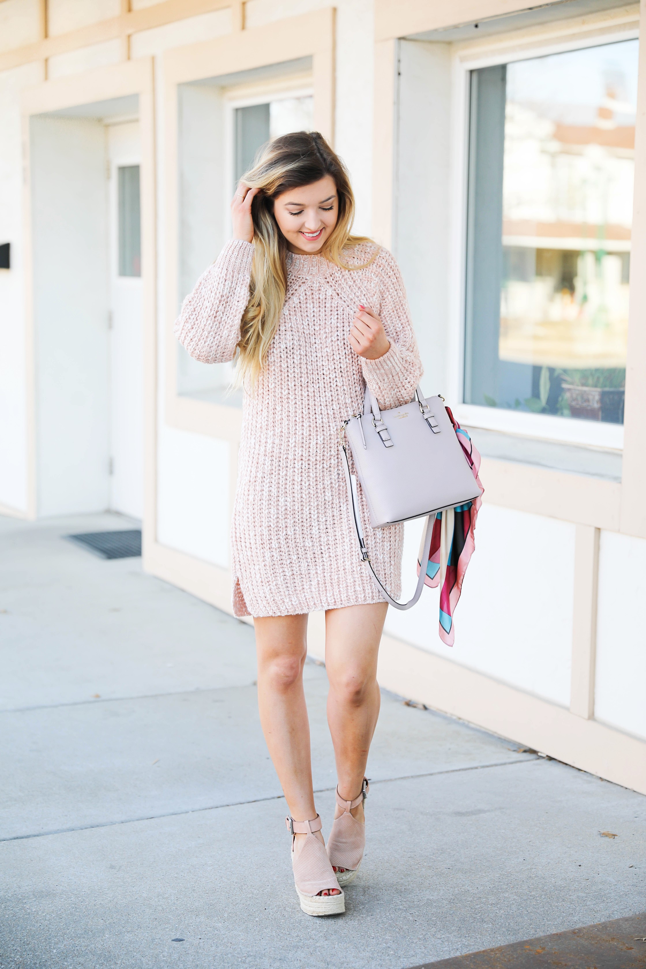 Pink sweater dress with kate spade bag! I love this Kate Spade bag with the pink scarf tied on it! It really adds some cute feminine flair! My new favorite purse! Details on fashion blog daily dose of charm by lauren lindmark