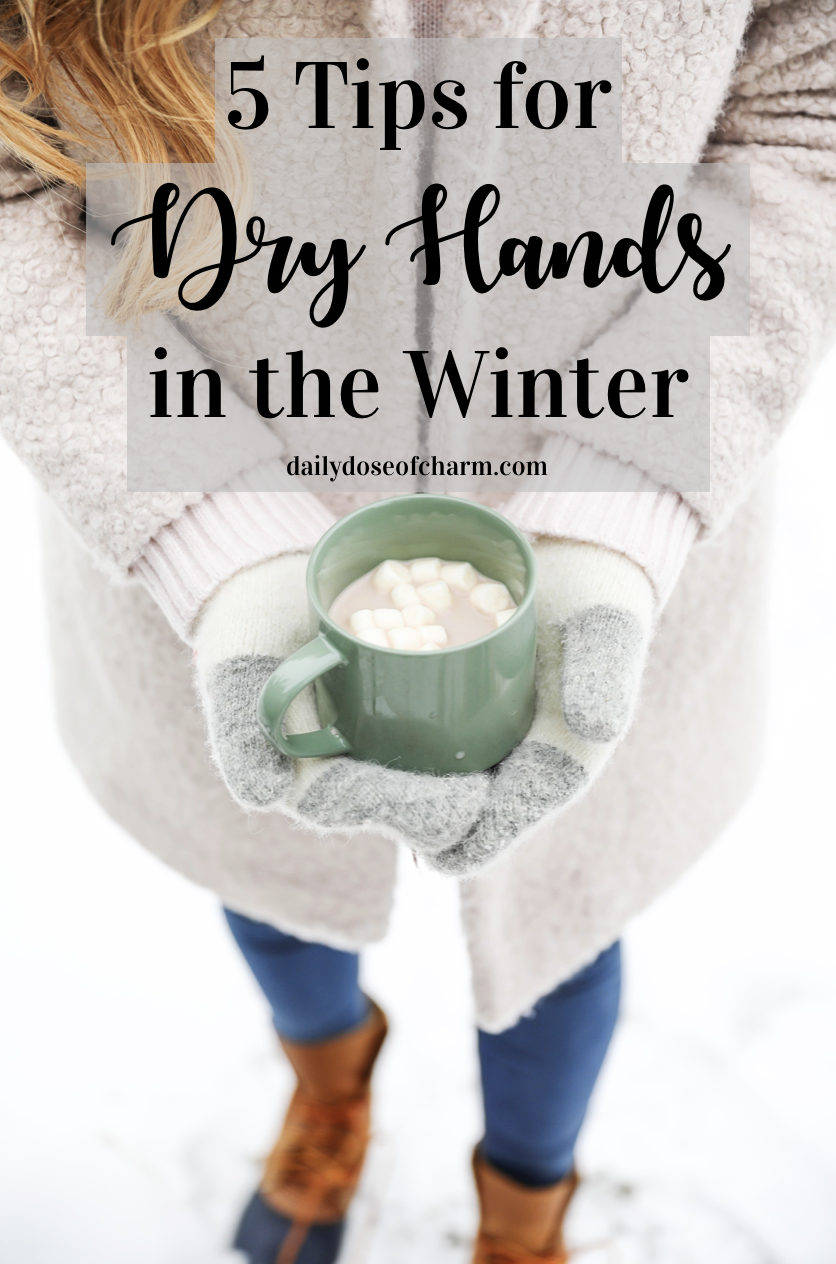 Cozy winter photo holding hot cocoa with mittens! How to protect your hands from the cold and snow! Tips for dry hand and cracked hands! Details on fashion blog daily dose of charm by lauren lindmark