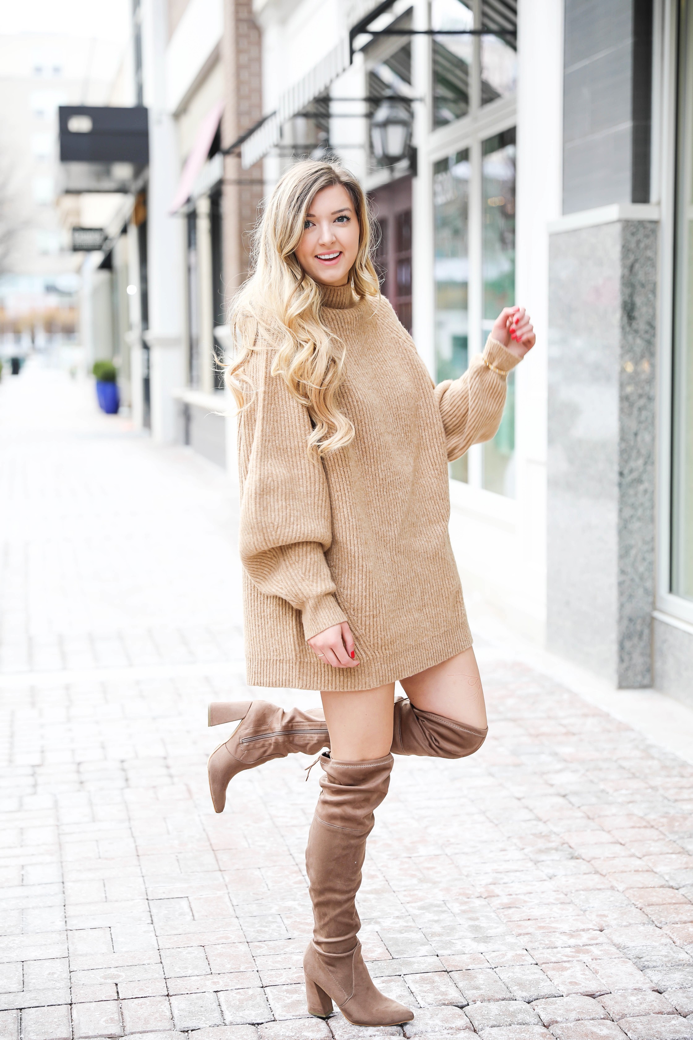 Tan sweater dress from h&m with puffy sleeves. Paired with tan over the knee heeled boots! I love otk boots for winter and spring. Details on fashion blog daily dose of charm by lauren lindmark