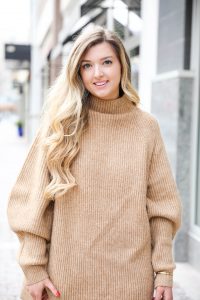 Tan sweater dress from h&m with puffy sleeves. Paired with tan over the knee heeled boots! I love otk boots for winter and spring. Details on fashion blog daily dose of charm by lauren lindmark