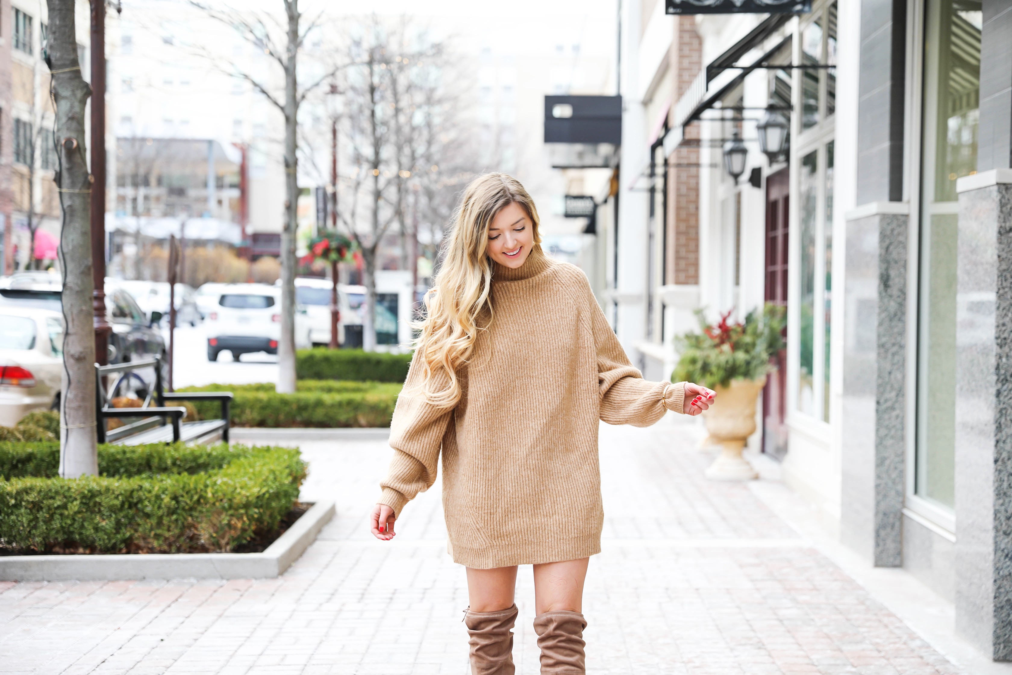 Tan sweater dress from h&m with puffy sleeves. Paired with tan over the knee heeled boots! I love otk boots for winter and spring. Details on fashion blog daily dose of charm by lauren lindmark