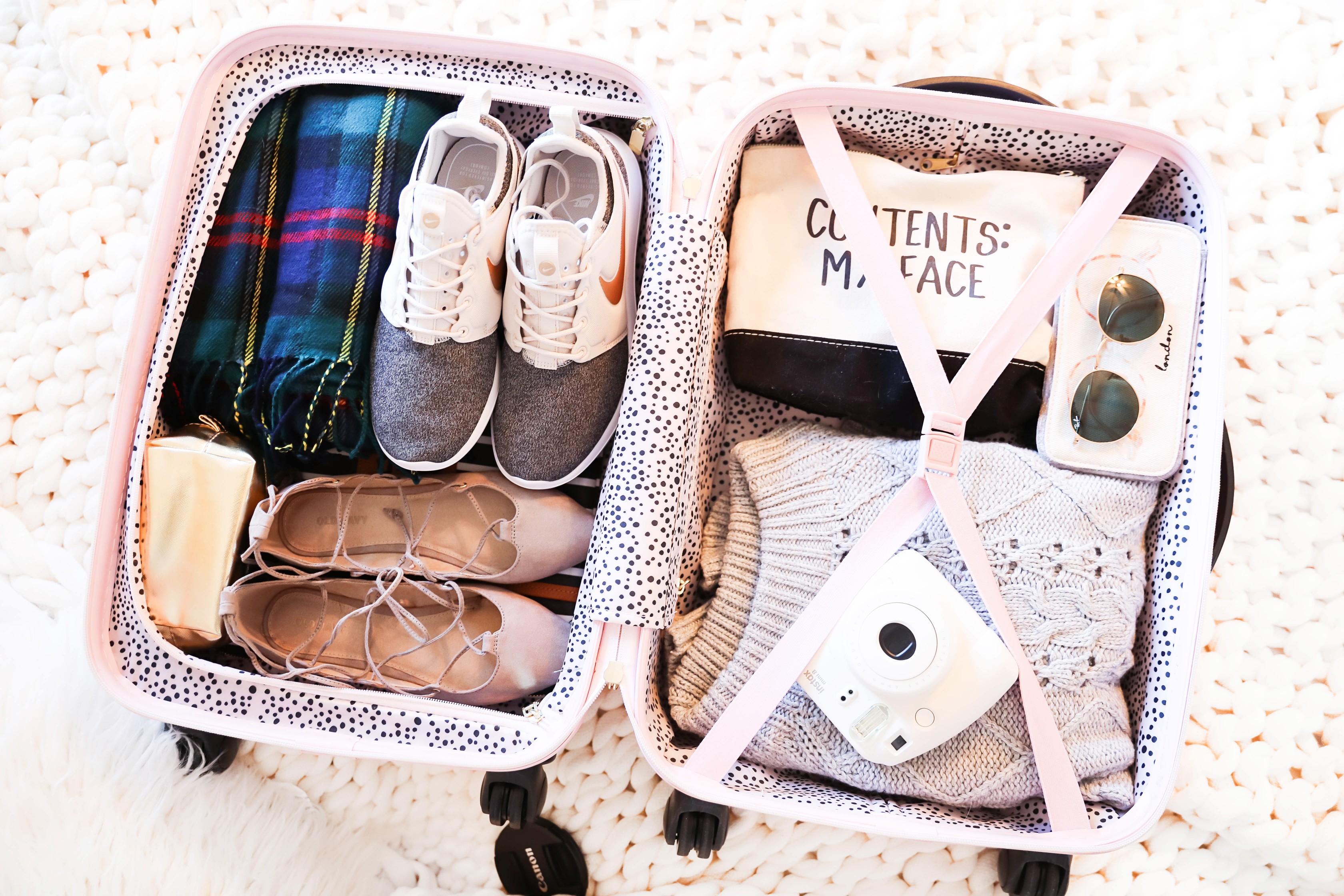 suitcase packing pink suitcase packed suitcase cute suitcase packing tips daily dose of charm lauren lindmark