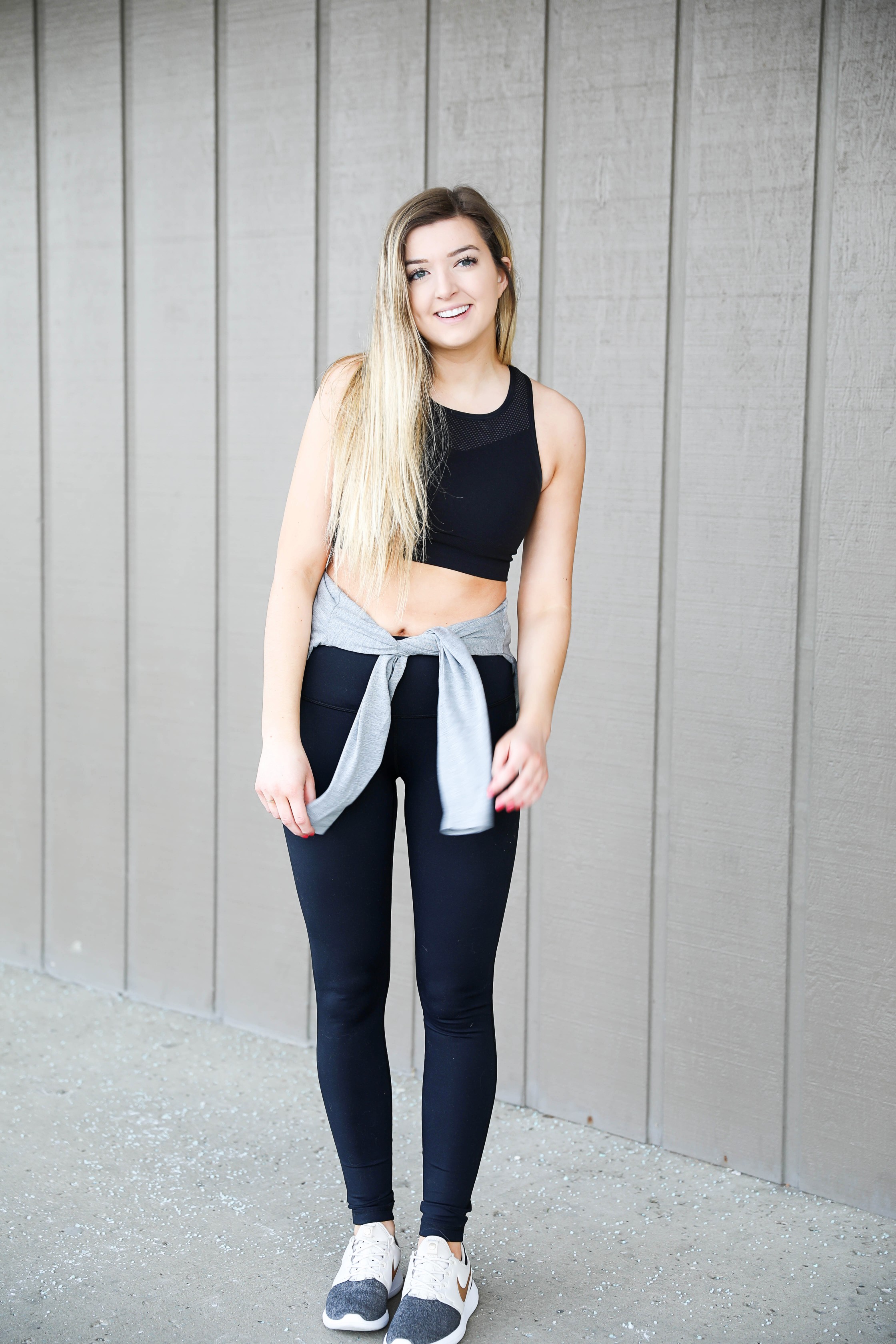 Cute workout look ideas! Athleisure outfit with a cute nike cropped tee, zella high waisted leggings, and nike two tone mesh sneakers with a gold logo! I love this athletic wear look! Details on fashion blog daily dose of charm lauren lindmark