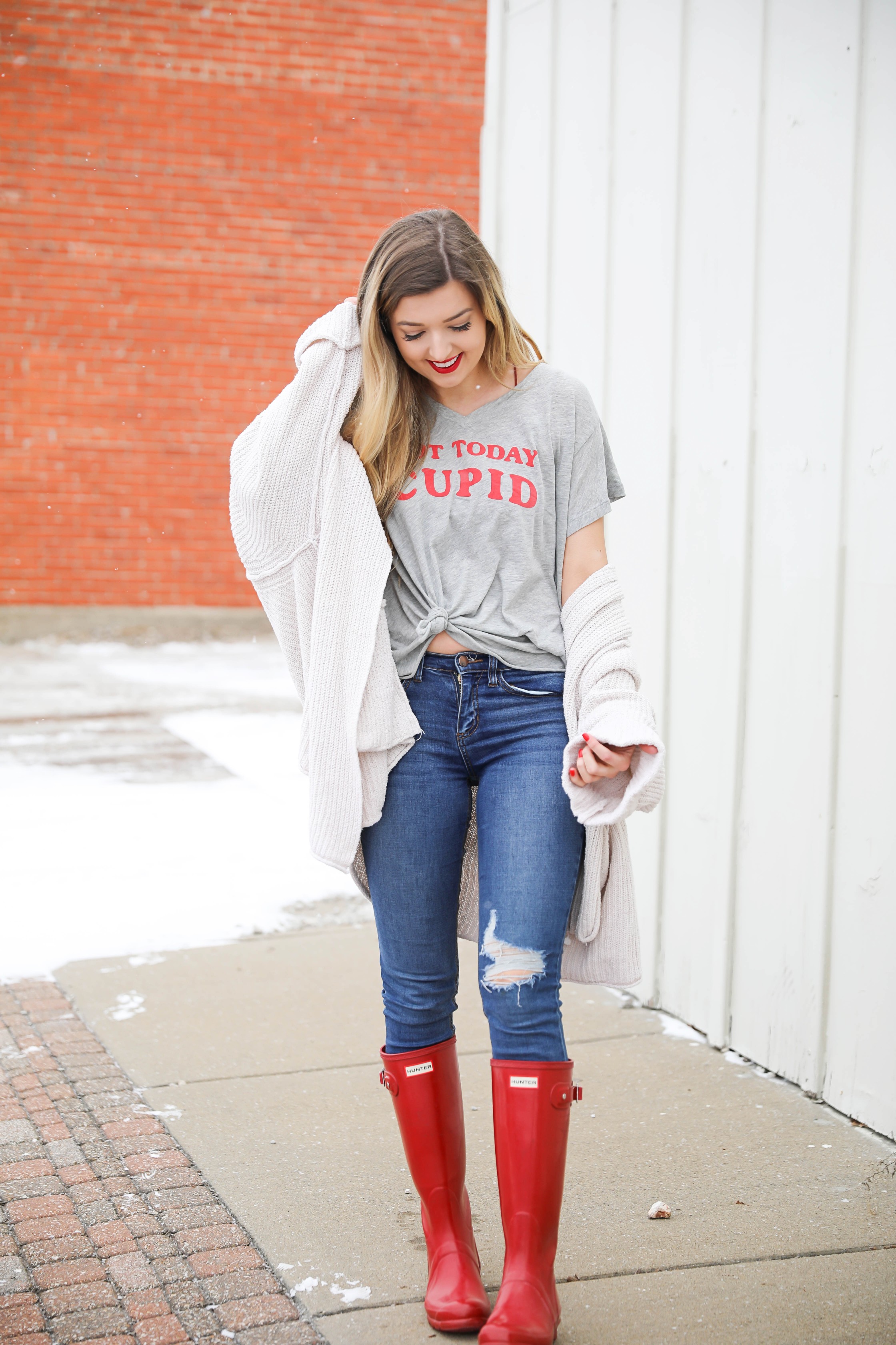 Not today cupid valentine's day tee! Single tee for Valentine's Day. I love this funny valentine's day shirt with free people low tide cardigan over it! I paired it with my red glossy hunter boots! Details on daily dose of charm by lauren lindmark