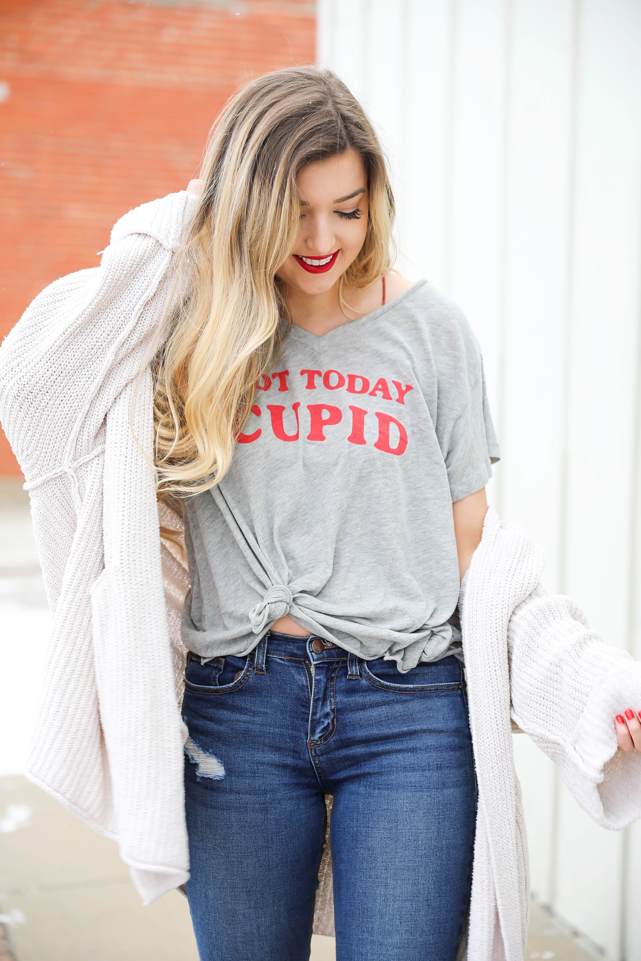 Not today cupid valentine's day tee! Single tee for Valentine's Day. I love this funny valentine's day shirt with free people low tide cardigan over it! I paired it with my red glossy hunter boots! Details on daily dose of charm by lauren lindmark