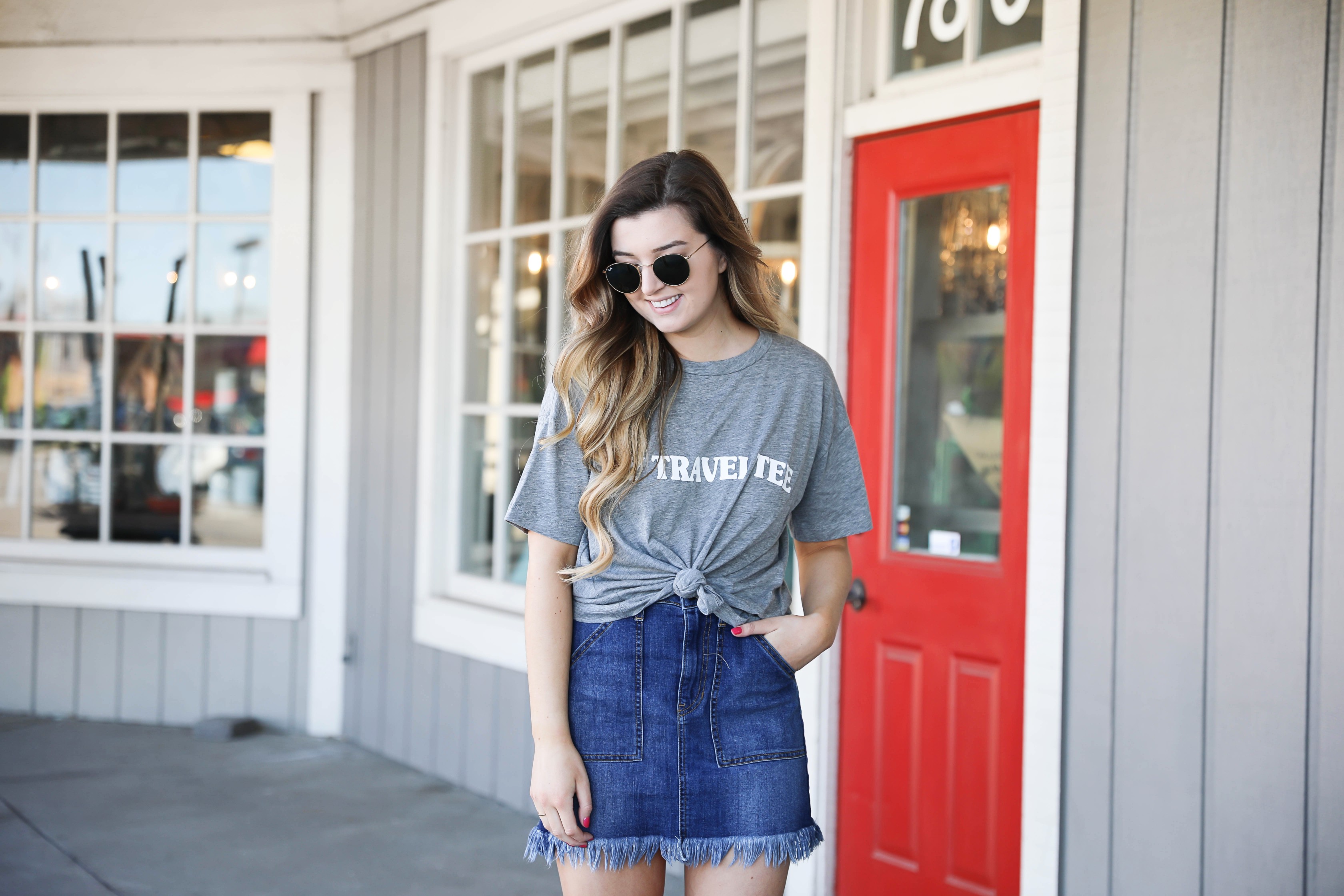 Show Me your mumu grey travel tee! This is such a cute travel tshirt! Not to mention, this jean skirt is adorable! I love how the jean skirt is frayed! Details on fashion blog daily dose of charm by lauren lindmark