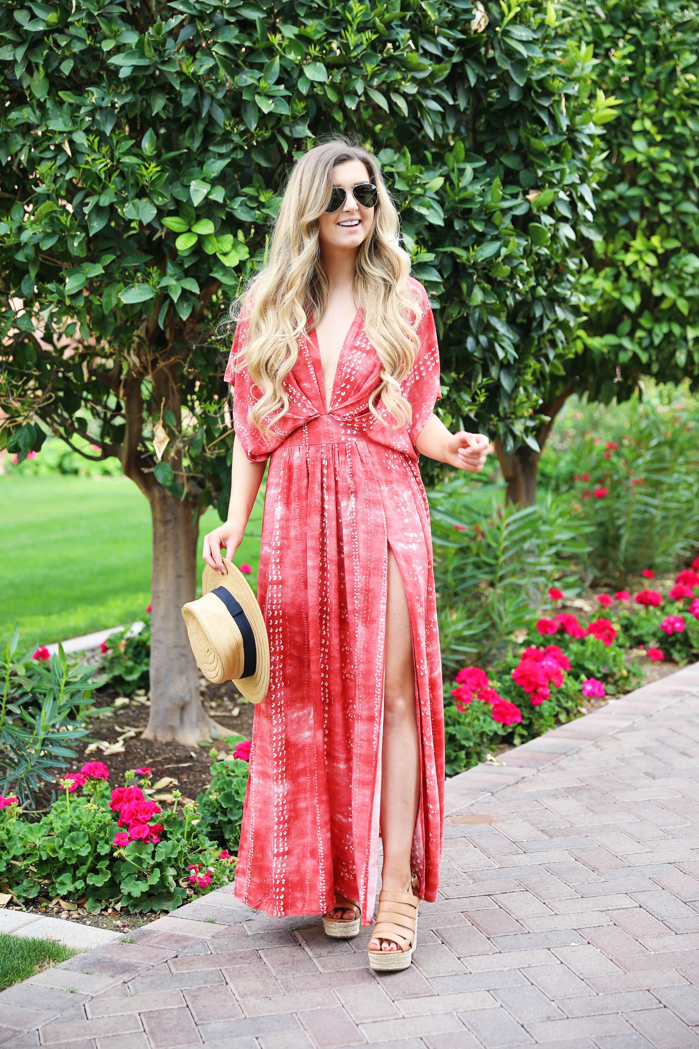 Red tie dye maxi dress from Showpo! Maxi dress with a cute plunging neckline paired with astraw hat and Marc fisher wedges! Details on fashion blog daily dose of charm by lauren lindmark spring break outfit ideas