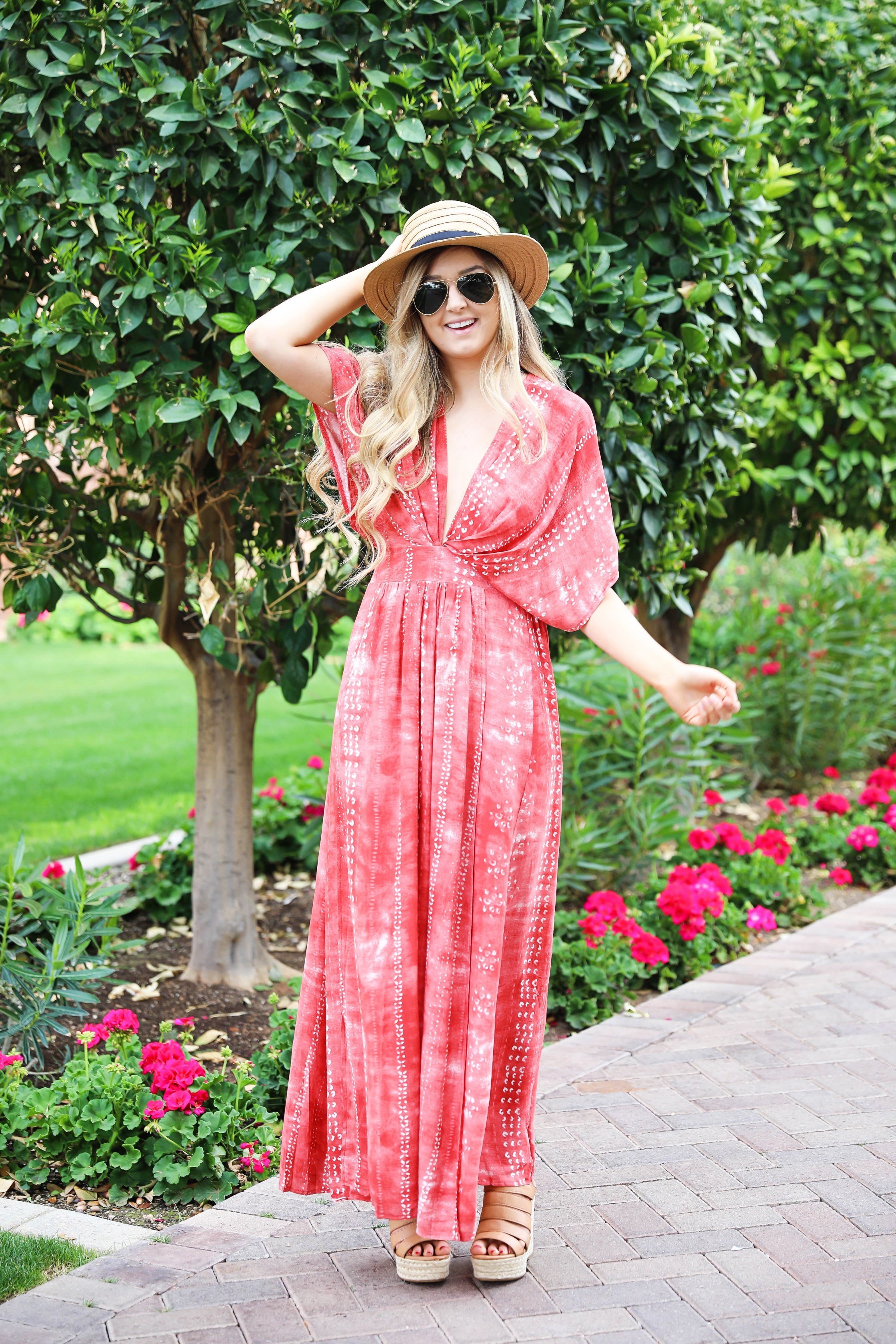 Red tie dye maxi dress from Showpo! Maxi dress with a cute plunging neckline paired with astraw hat and Marc fisher wedges! Details on fashion blog daily dose of charm by lauren lindmark spring break outfit ideas