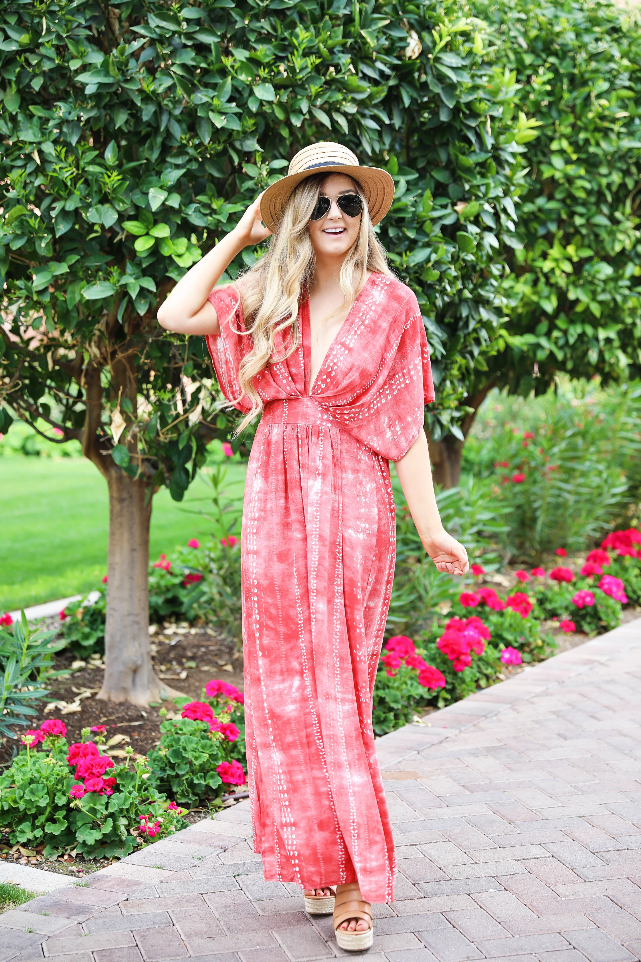 Red tie dye maxi dress from Showpo! Maxi dress with a cute plunging neckline paired with astraw hat and Marc fisher wedges! Details on fashion blog daily dose of charm by lauren lindmark spring break outfit ideas