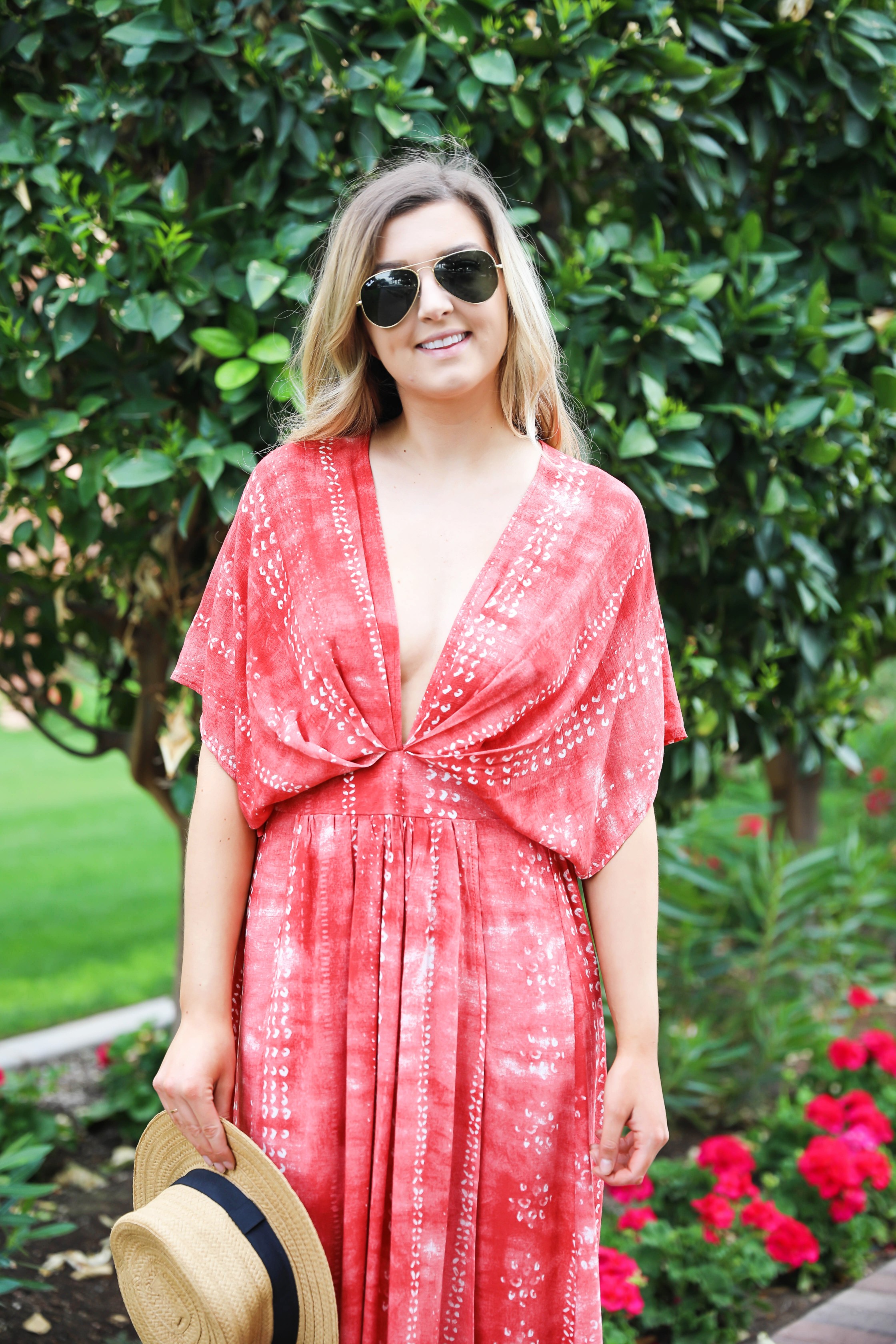 Red tie dye maxi dress from Showpo! Maxi dress with a cute plunging neckline paired with astraw hat and Marc fisher wedges! Details on fashion blog daily dose of charm by lauren lindmark spring break outfit ideas