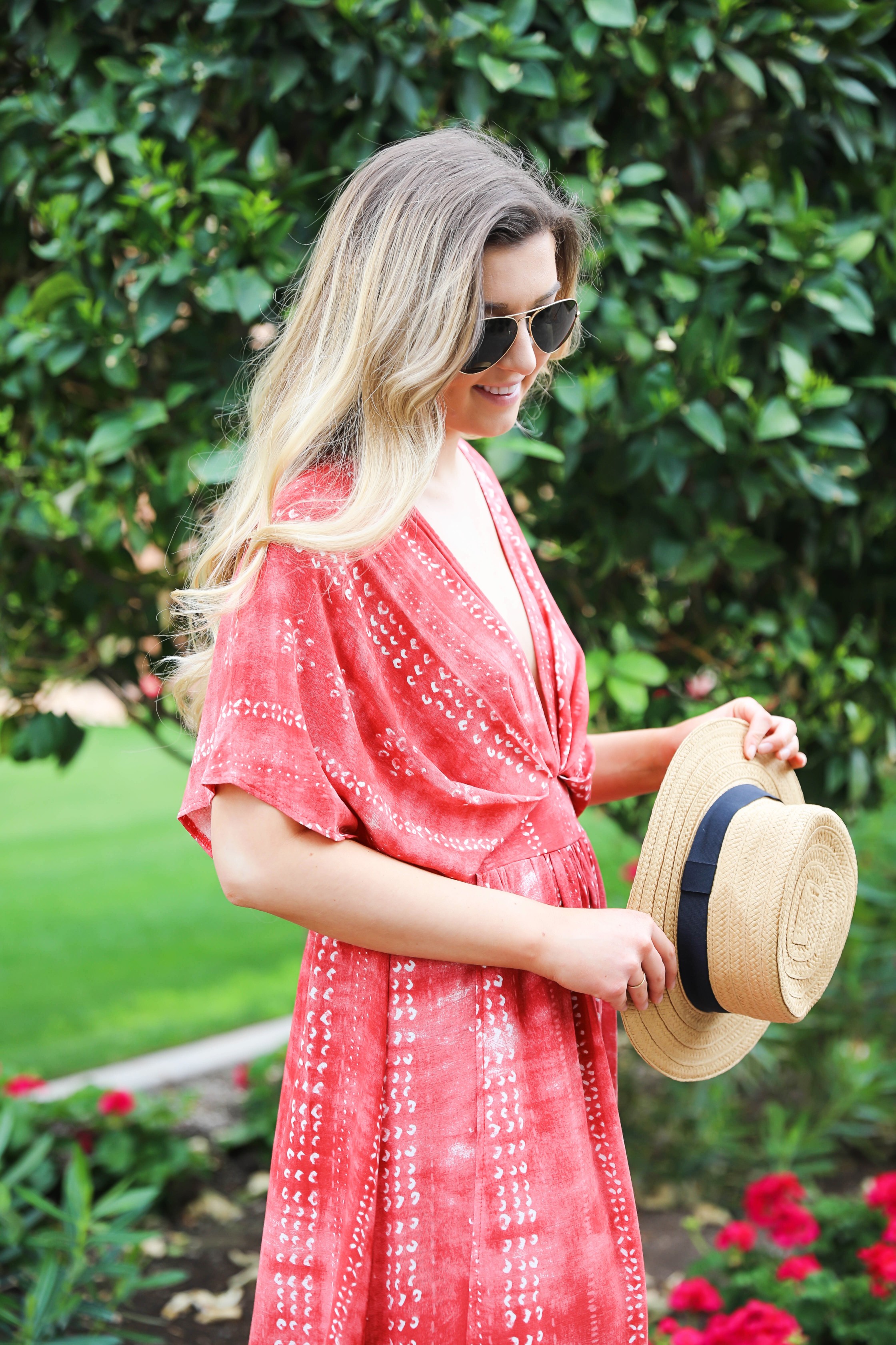 Red tie dye maxi dress from Showpo! Maxi dress with a cute plunging neckline paired with astraw hat and Marc fisher wedges! Details on fashion blog daily dose of charm by lauren lindmark spring break outfit ideas