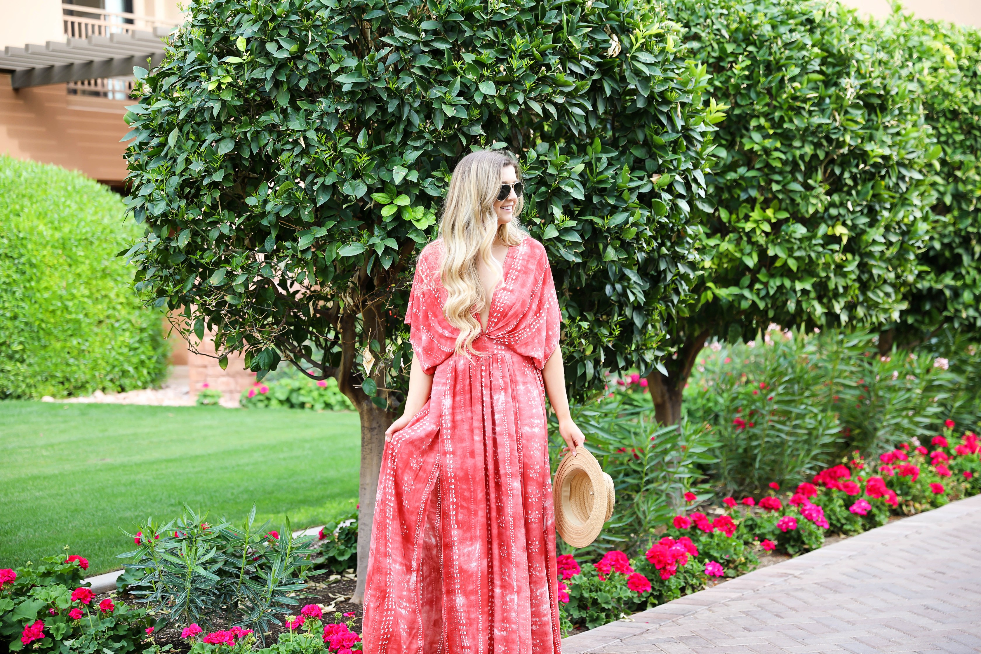 Red tie dye maxi dress from Showpo! Maxi dress with a cute plunging neckline paired with astraw hat and Marc fisher wedges! Details on fashion blog daily dose of charm by lauren lindmark spring break outfit ideas