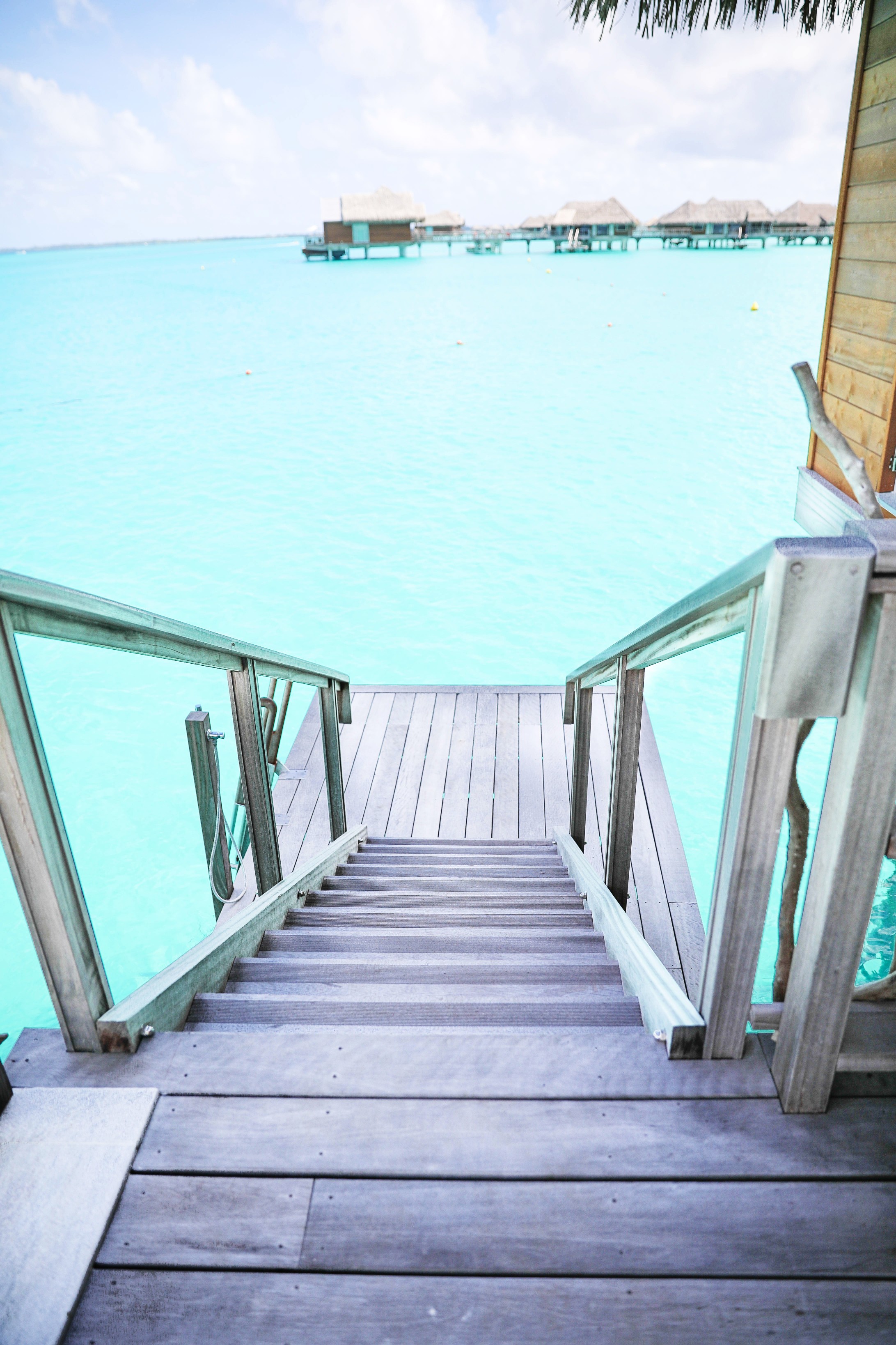 Bora Bora Villa tour at the Intercontinental Hotel Thalasso ! Lauren Lindmark is a fashion and travel blogger! See travel photos of the beautiful blue ocean in Bora Bora, French Polynesia on fashion blog daily dose of charm by lauren Lindmark