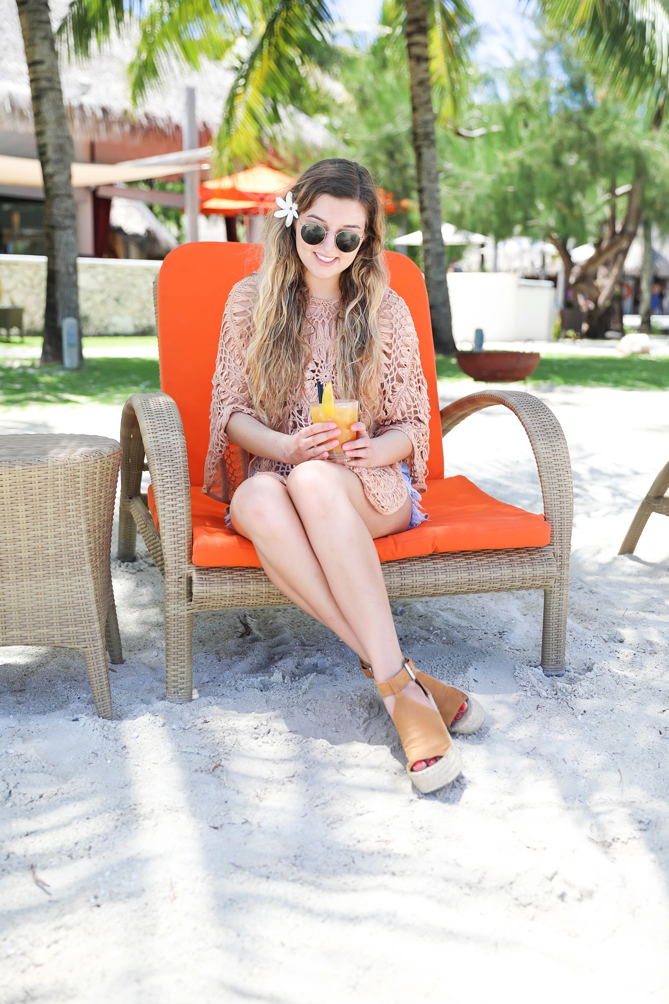 Crochet pool coverup for spring break and summer! Photos on orange pool chair! Bora Bora island vacation photos! Details on fashion blog daily dose of charm by lauren lindmark