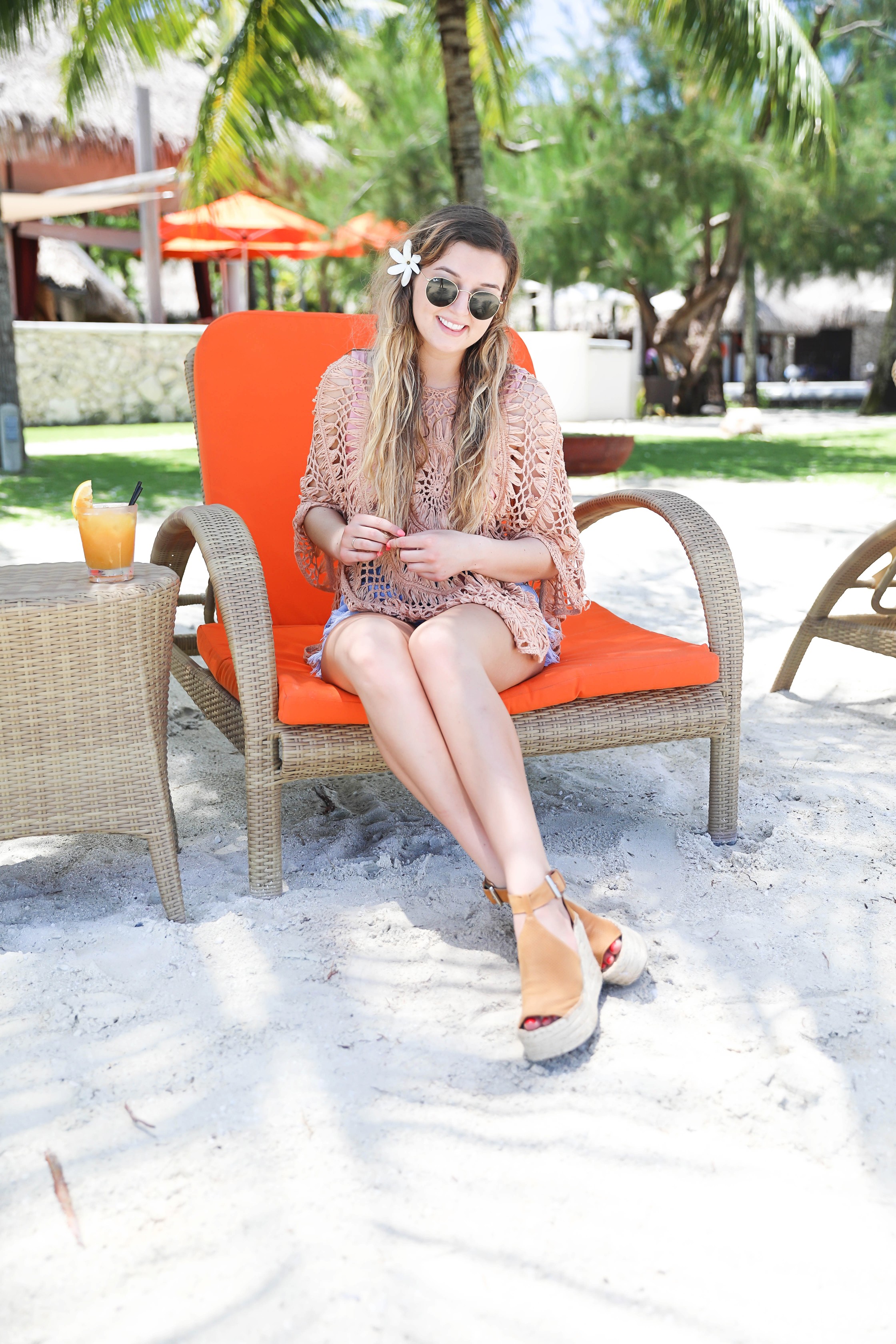 Crochet pool coverup for spring break and summer! Photos on orange pool chair! Bora Bora island vacation photos! Details on fashion blog daily dose of charm by lauren lindmark