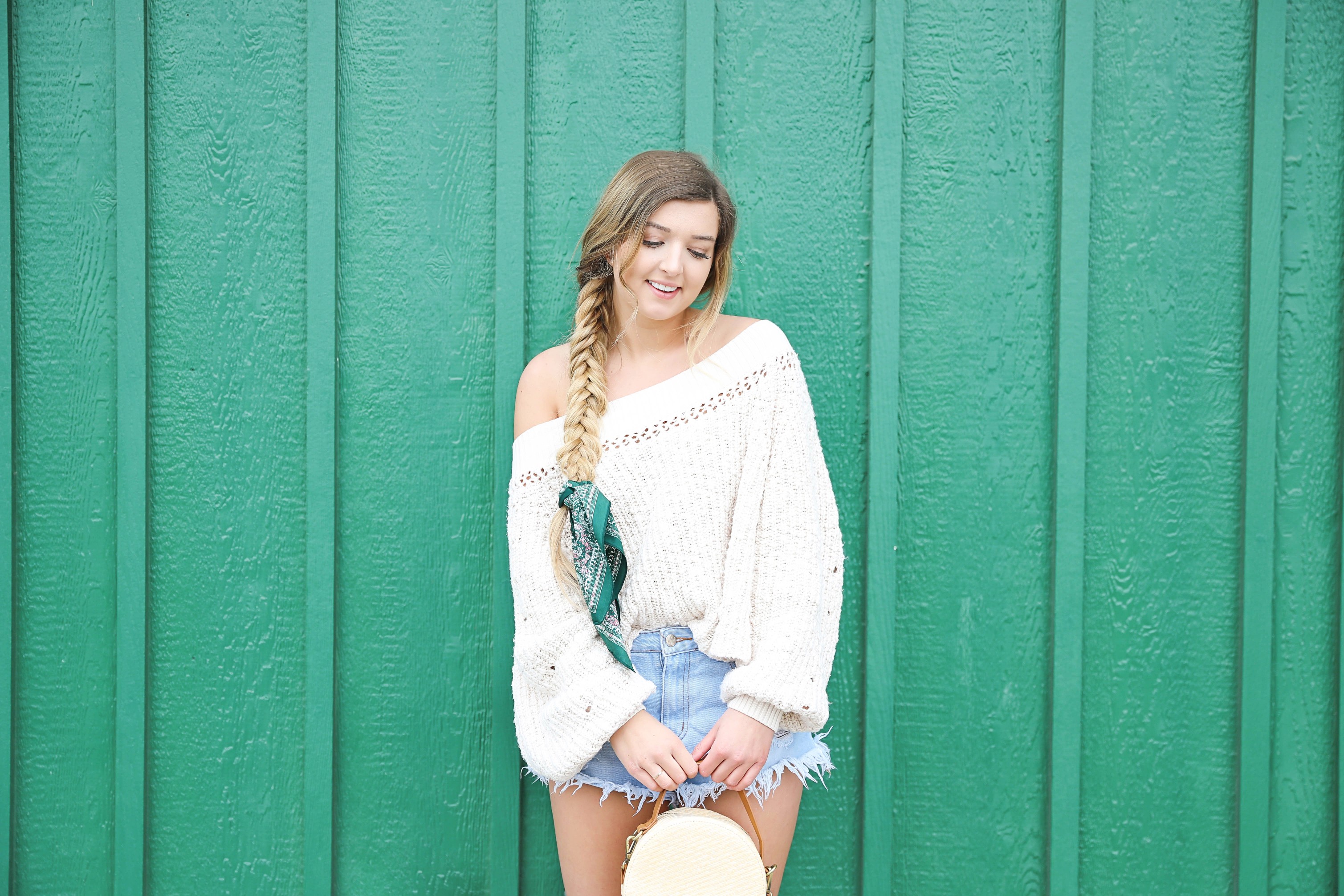 Free People slouchy off the shoulder cream sweater! Paired with light wash ripped denim shorts and a silk hair scarf tied around my fishtail braid! Get details on fashion blog daily dose of charm by lauren lindmark