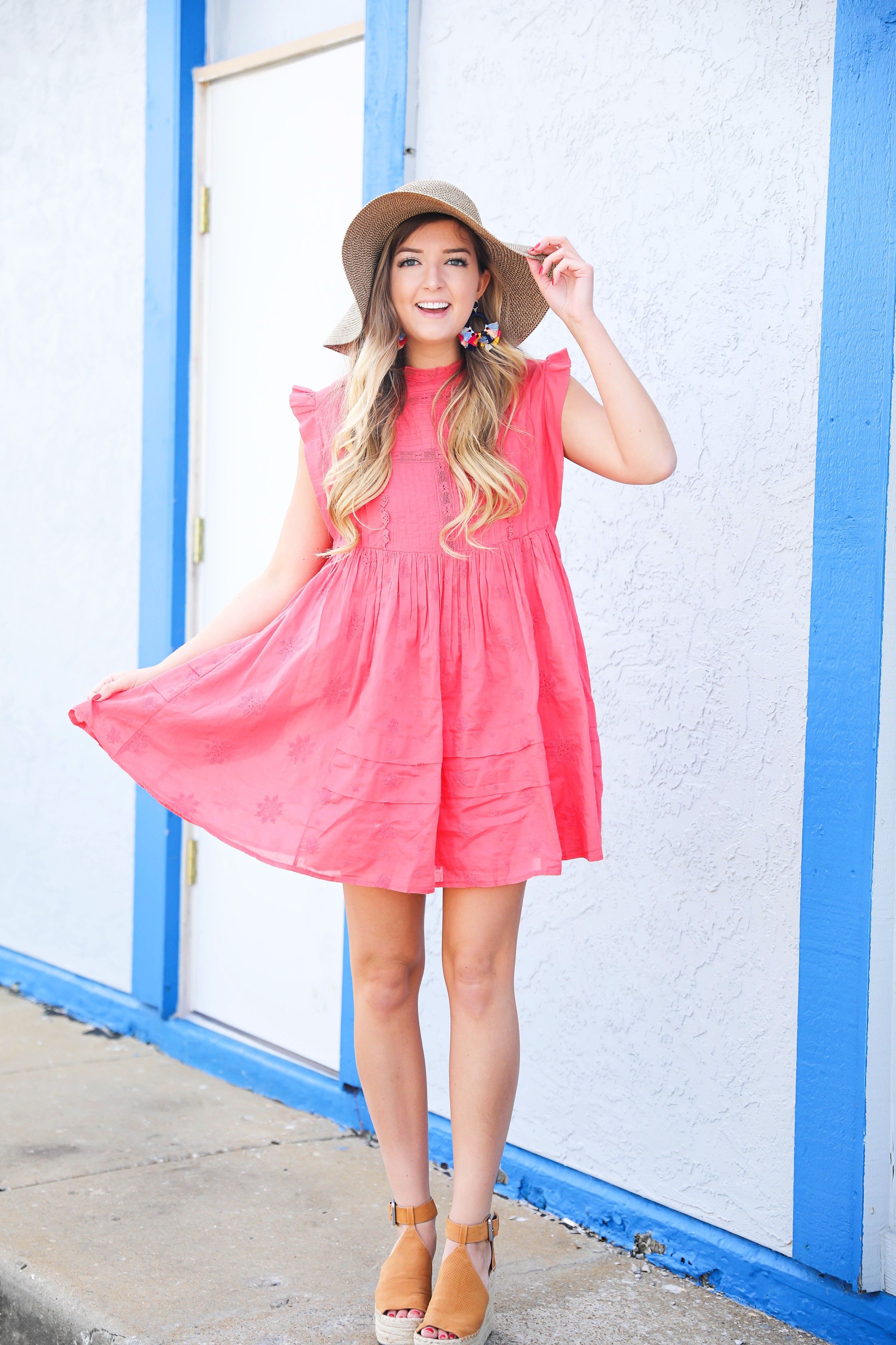 Coral babydoll dress by free people with floppy hat and bright tassel baublebar earrings! I love this outfit, it gives off Caribbean vibes because it is such a bright outfit! Details on fashion blog daily dose of charm by lauren lindmark