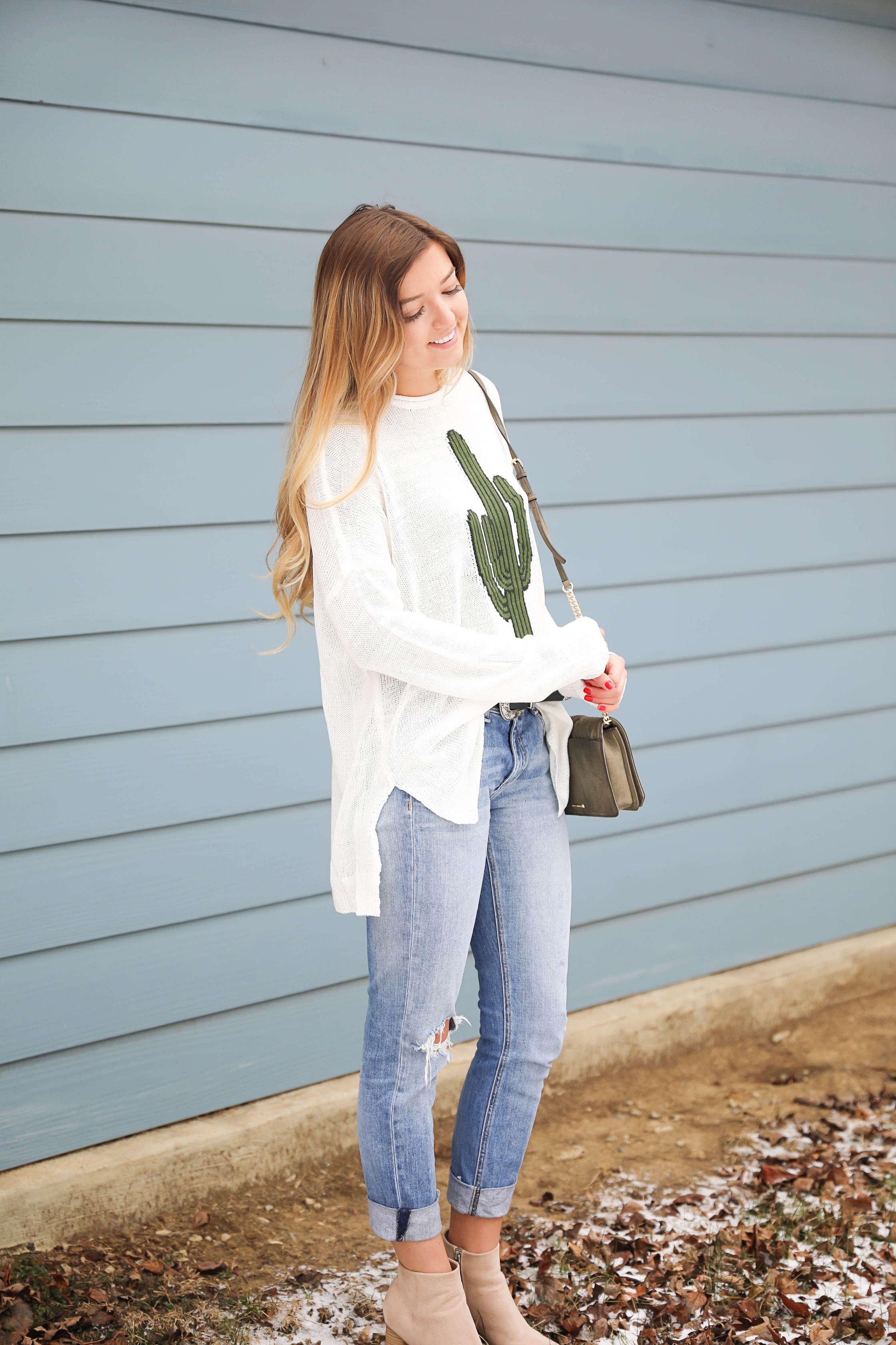 Super cute cactus sweater for spring and summer! This sweater is by Show Me Your Mumu. I love their spring cactus line, but this cactus sweater is my favorite! I paired it with booties, a black belt, and a Rebecca Minkoff bag! Perfect spring outfit inspiration on fashion blog daily dose of charm by lauren lindmark