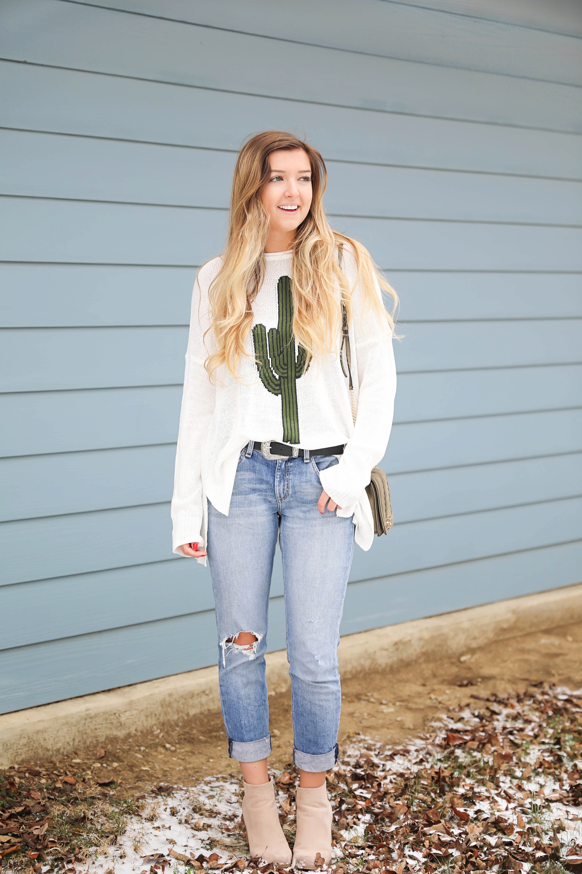 Super cute cactus sweater for spring and summer! This sweater is by Show Me Your Mumu. I love their spring cactus line, but this cactus sweater is my favorite! I paired it with booties, a black belt, and a Rebecca Minkoff bag! Perfect spring outfit inspiration on fashion blog daily dose of charm by lauren lindmark