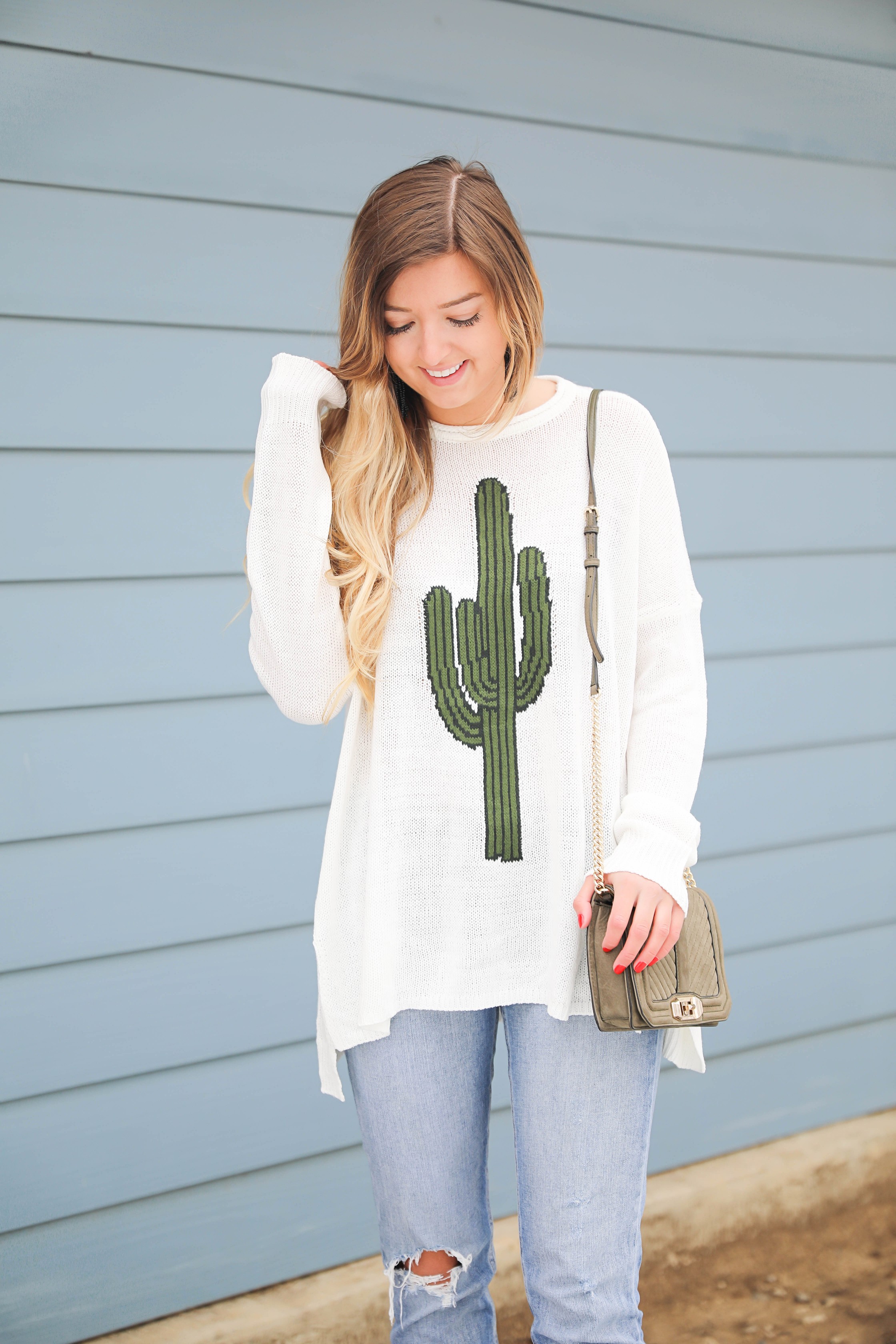 Super cute cactus sweater for spring and summer! This sweater is by Show Me Your Mumu. I love their spring cactus line, but this cactus sweater is my favorite! I paired it with booties, a black belt, and a Rebecca Minkoff bag! Perfect spring outfit inspiration on fashion blog daily dose of charm by lauren lindmark