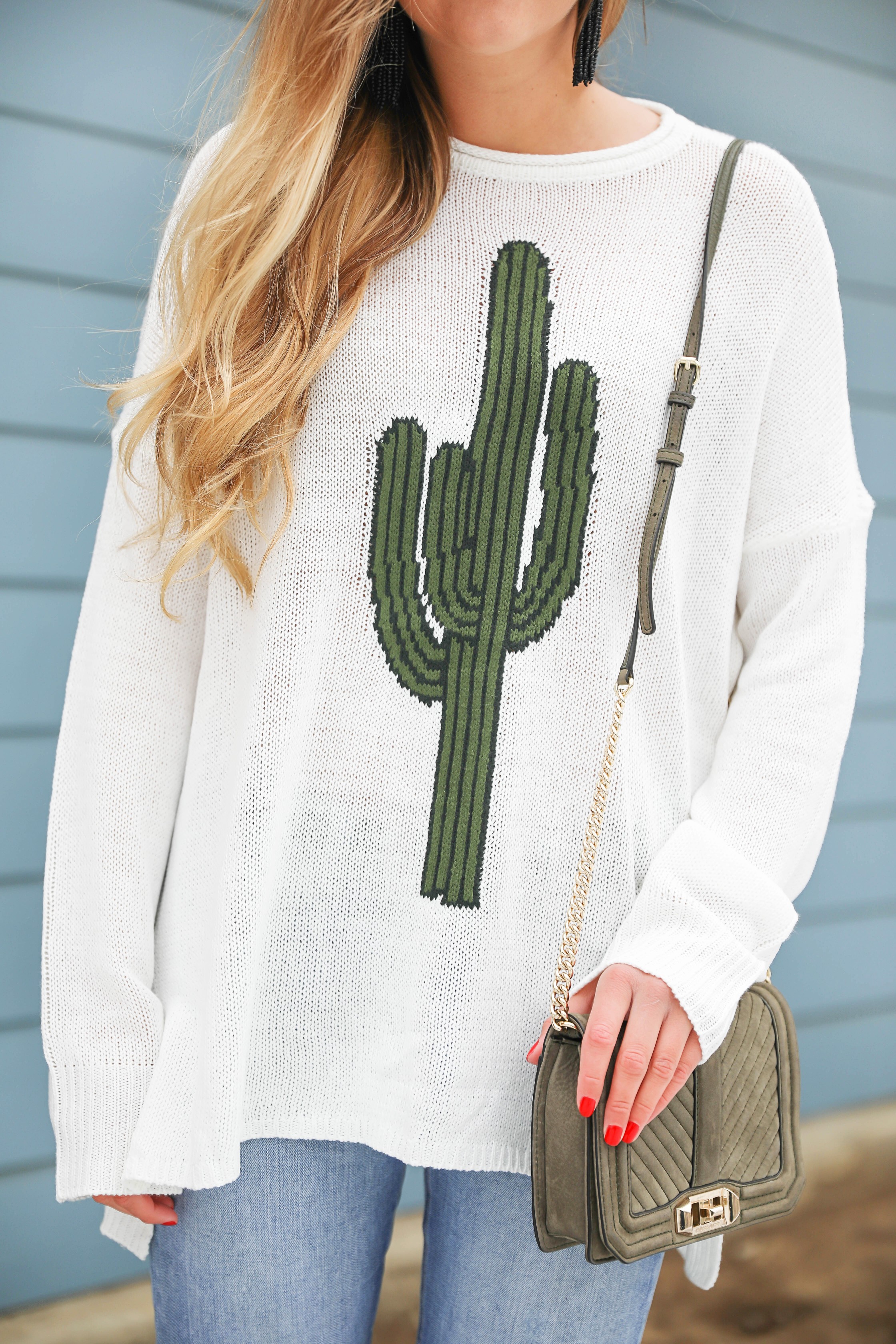 Super cute cactus sweater for spring and summer! This sweater is by Show Me Your Mumu. I love their spring cactus line, but this cactus sweater is my favorite! I paired it with booties, a black belt, and a Rebecca Minkoff bag! Perfect spring outfit inspiration on fashion blog daily dose of charm by lauren lindmark