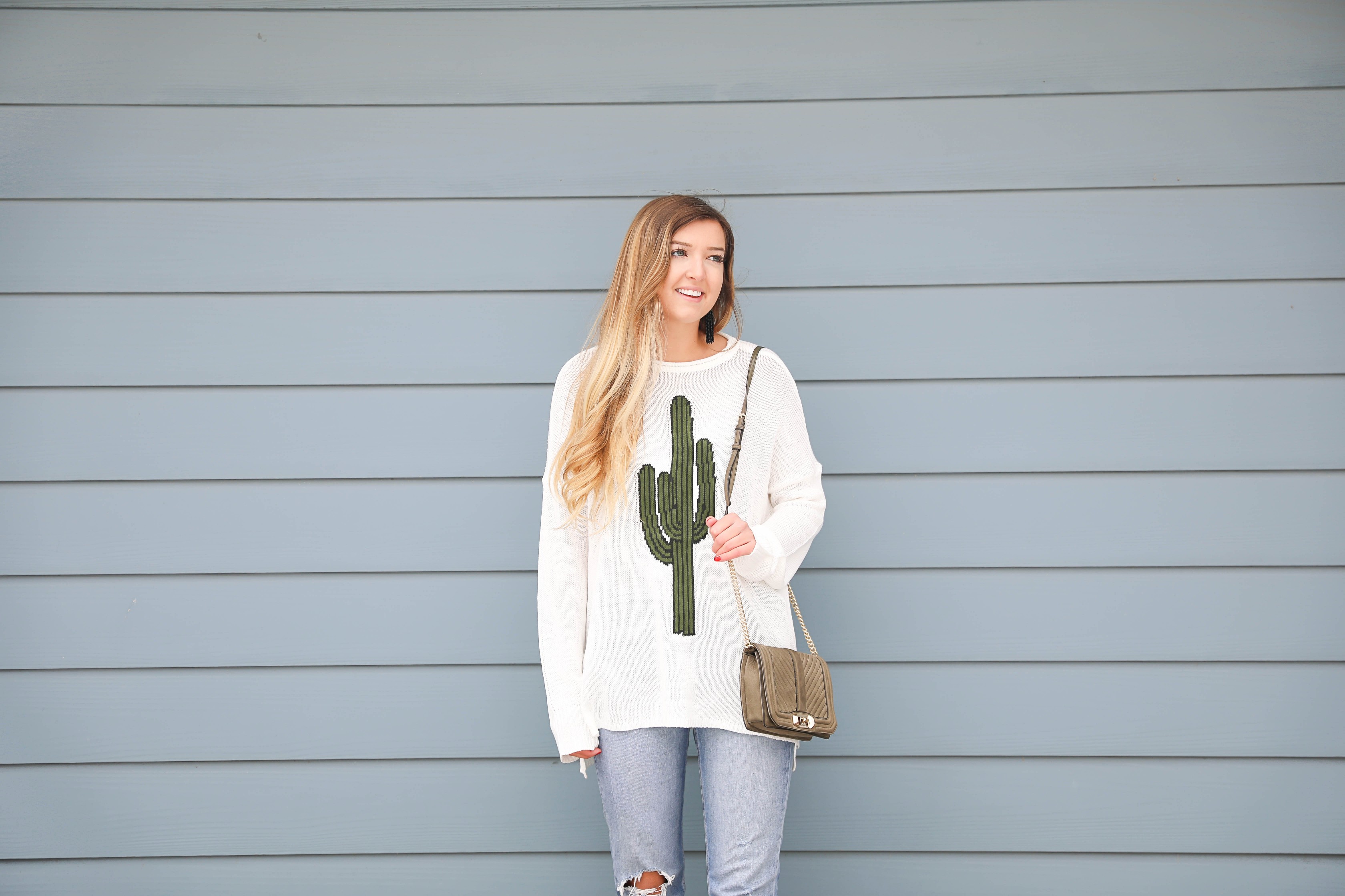 Super cute cactus sweater for spring and summer! This sweater is by Show Me Your Mumu. I love their spring cactus line, but this cactus sweater is my favorite! I paired it with booties, a black belt, and a Rebecca Minkoff bag! Perfect spring outfit inspiration on fashion blog daily dose of charm by lauren lindmark