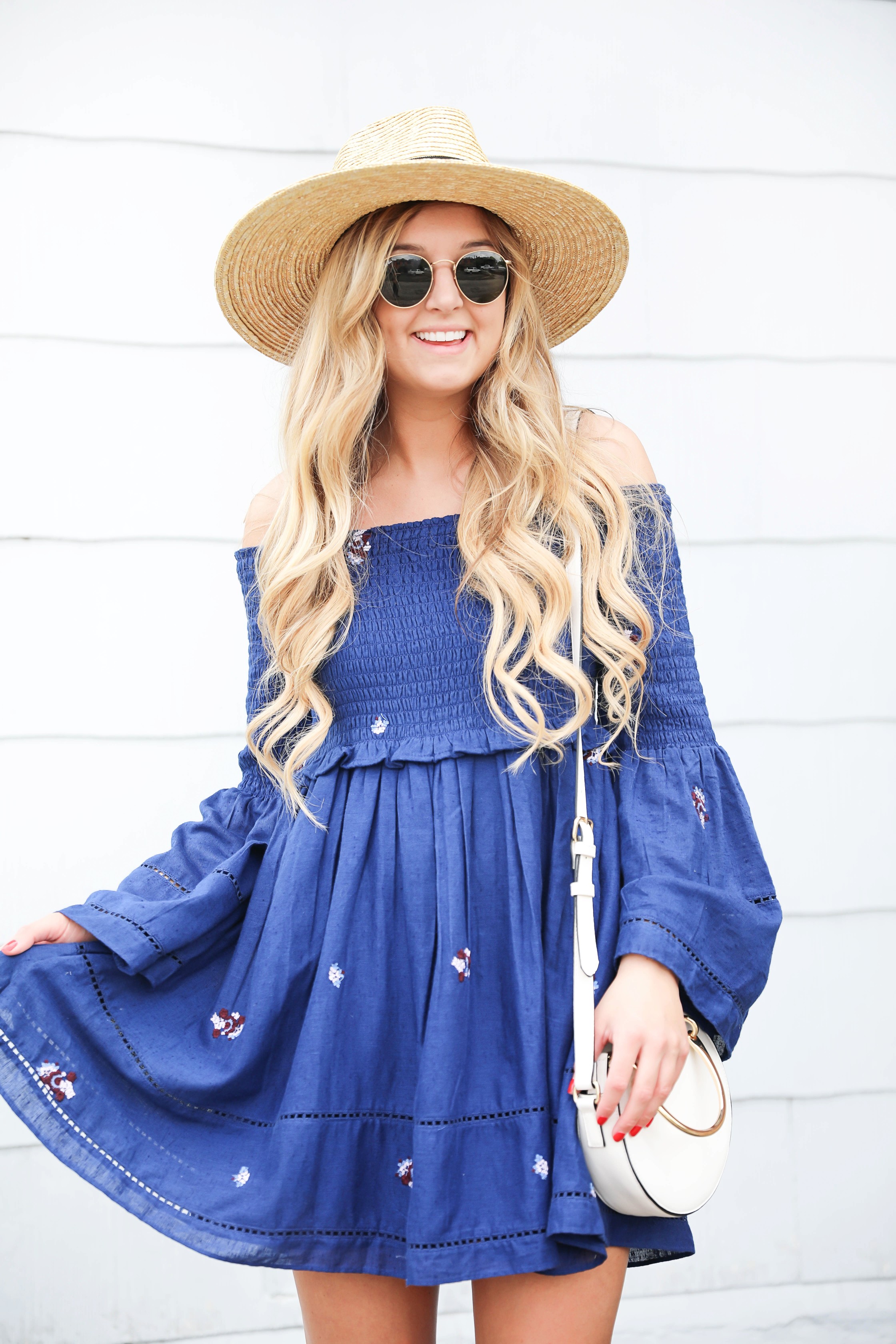 Navy free people off the shoulder embroidered dress! Love this summer fashion look! This summer dress will be perfect for days on the town or nights out! Details on fashion blog daily dose of charm by fashion blogger lauren lindmark