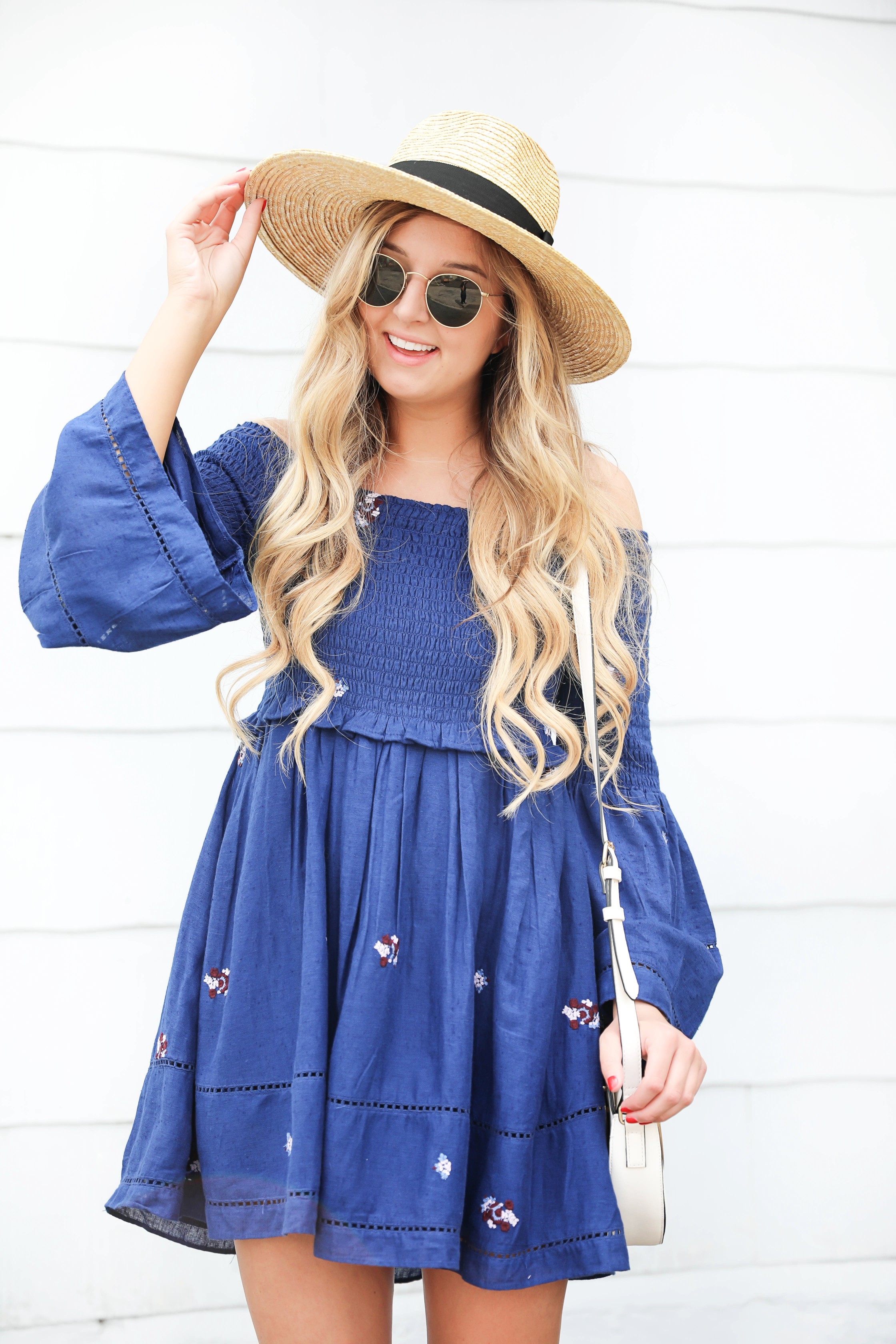 Navy free people off the shoulder embroidered dress! Love this summer fashion look! This summer dress will be perfect for days on the town or nights out! Details on fashion blog daily dose of charm by fashion blogger lauren lindmark