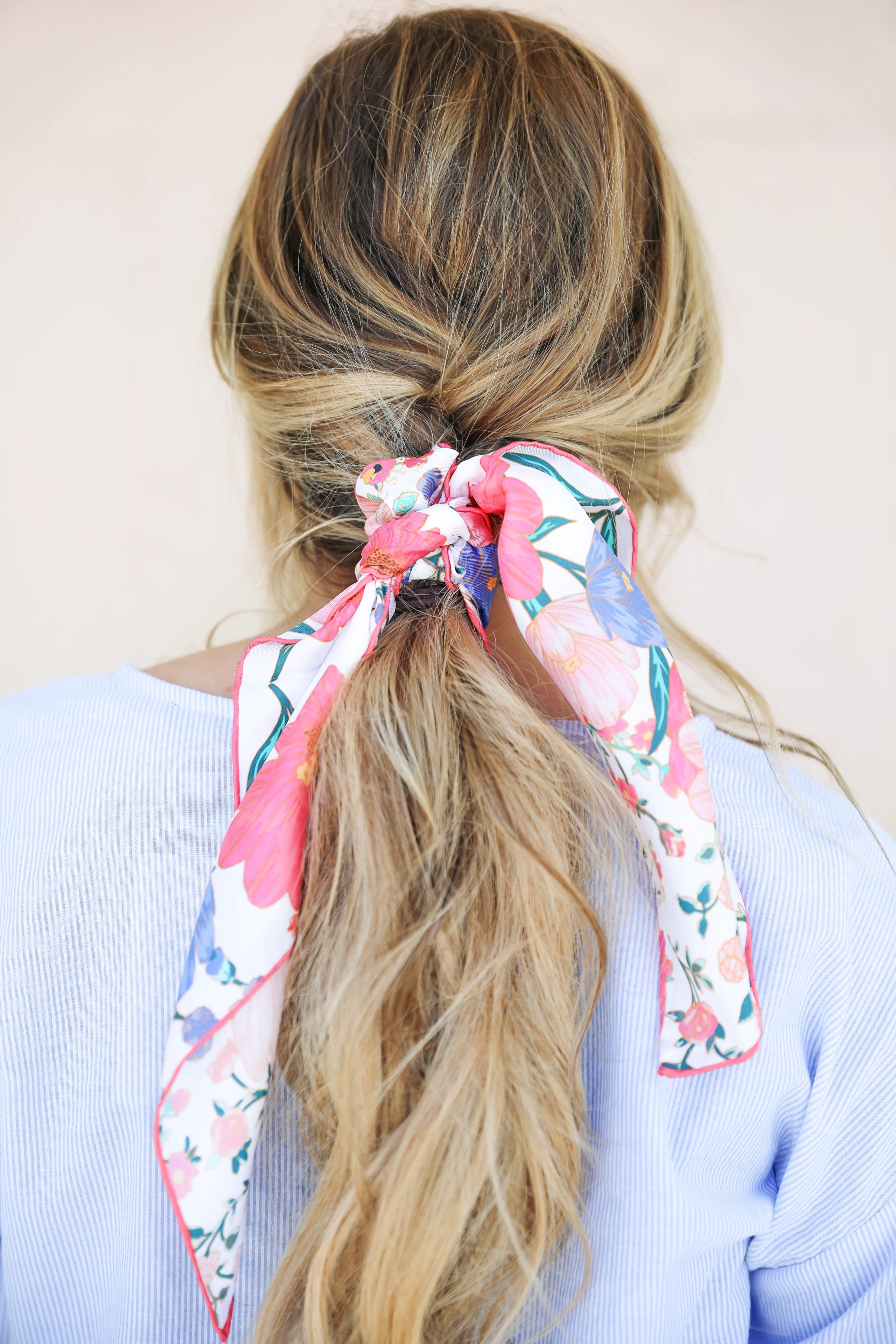 Seersucker peplum top from the Blue Door Boutique paired with white jeans and cute wedges! I love this preppy look, this kate spade silk scarf I super in for spring! I love this spring outfit! Silk scarf hairstyle idea! I love scarves and ponytails on fashion blog daily dose of charm by lauren lindmark