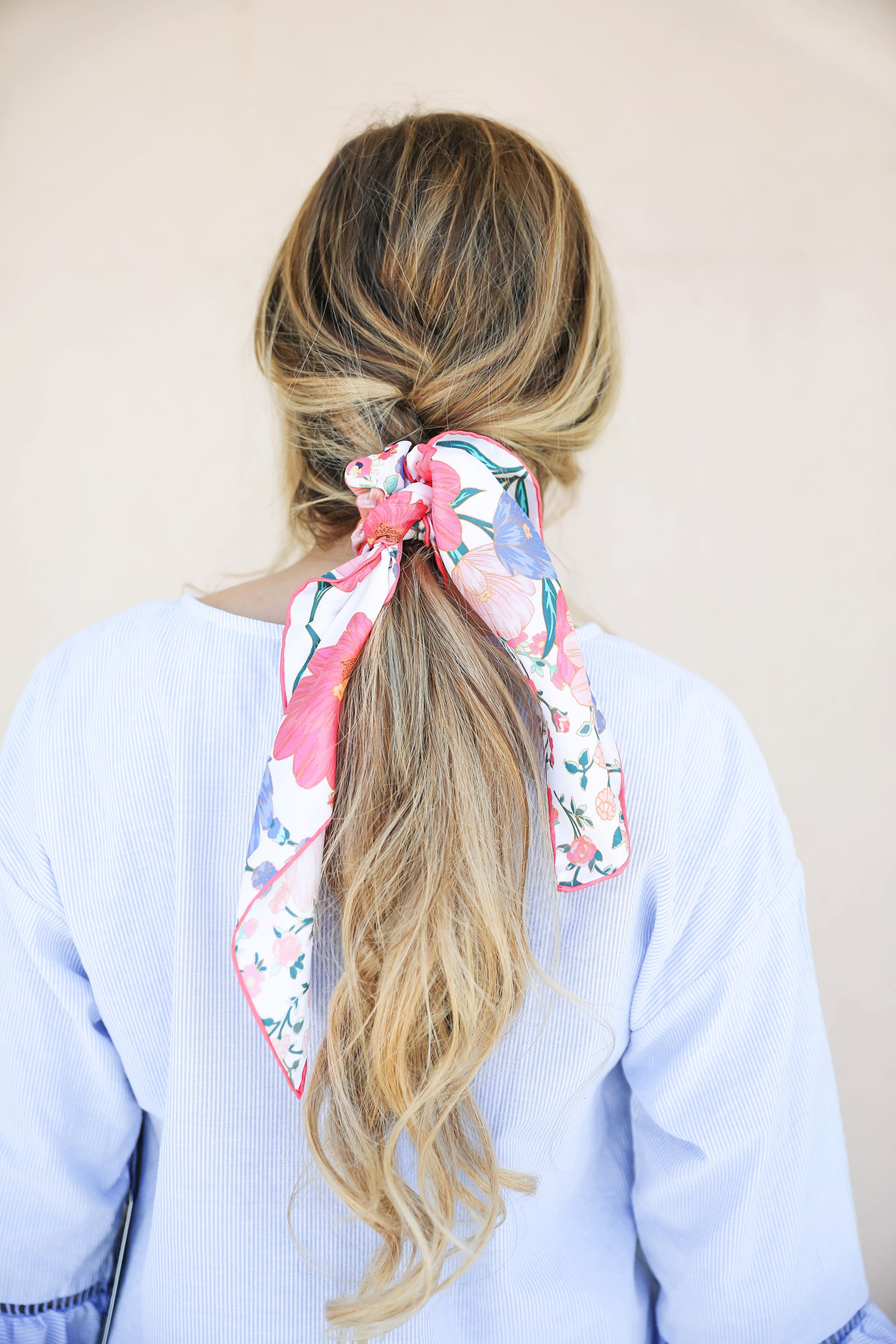 Seersucker peplum top from the Blue Door Boutique paired with white jeans and cute wedges! I love this preppy look, this kate spade silk scarf I super in for spring! I love this spring outfit! Silk scarf hairstyle idea! I love scarves and ponytails on fashion blog daily dose of charm by lauren lindmark