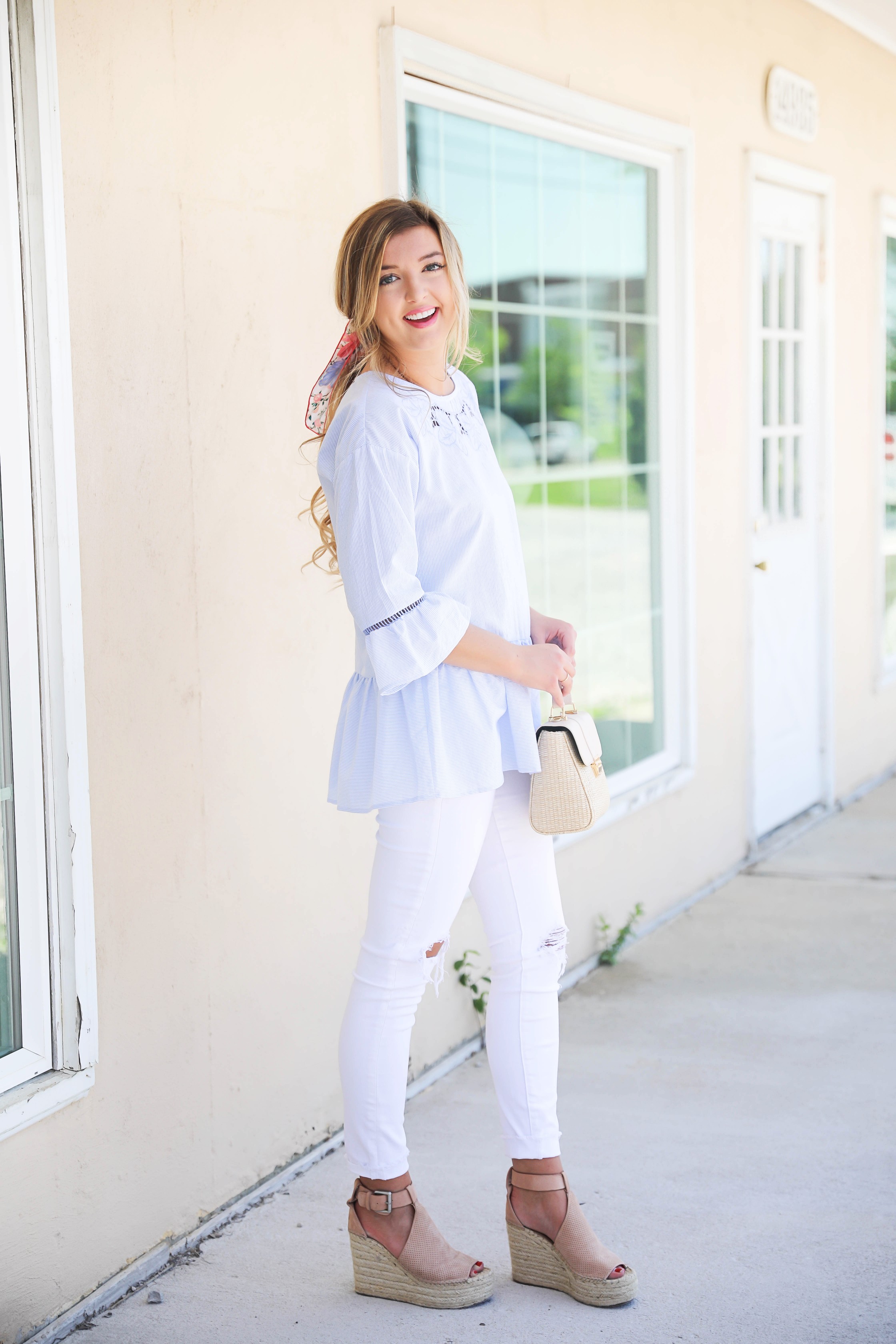 Seersucker peplum top from the Blue Door Boutique paired with white jeans and cute wedges! I love this preppy look, this kate spade silk scarf I super in for spring! I love this spring outfit! Silk scarf hairstyle idea! I love scarves and ponytails on fashion blog daily dose of charm by lauren lindmark