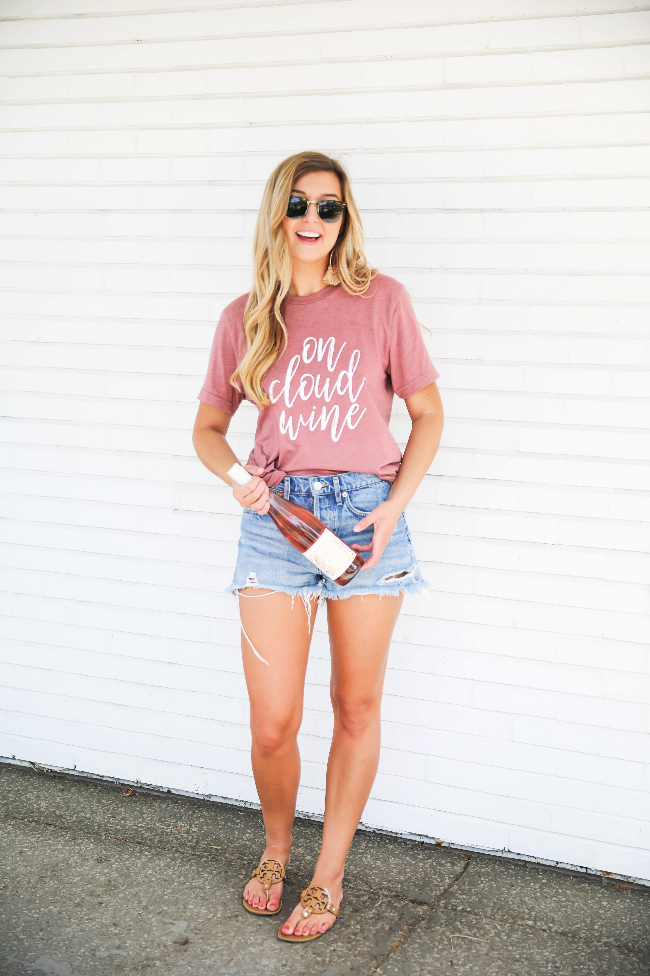 National Rosé Day 2018! I love this on cloud wine tshirt! Wine tees are my favorite! I paired it with the best ripped denim shorts in the world! Get the details on fashion blog daily dose of charm by lauren lindmark