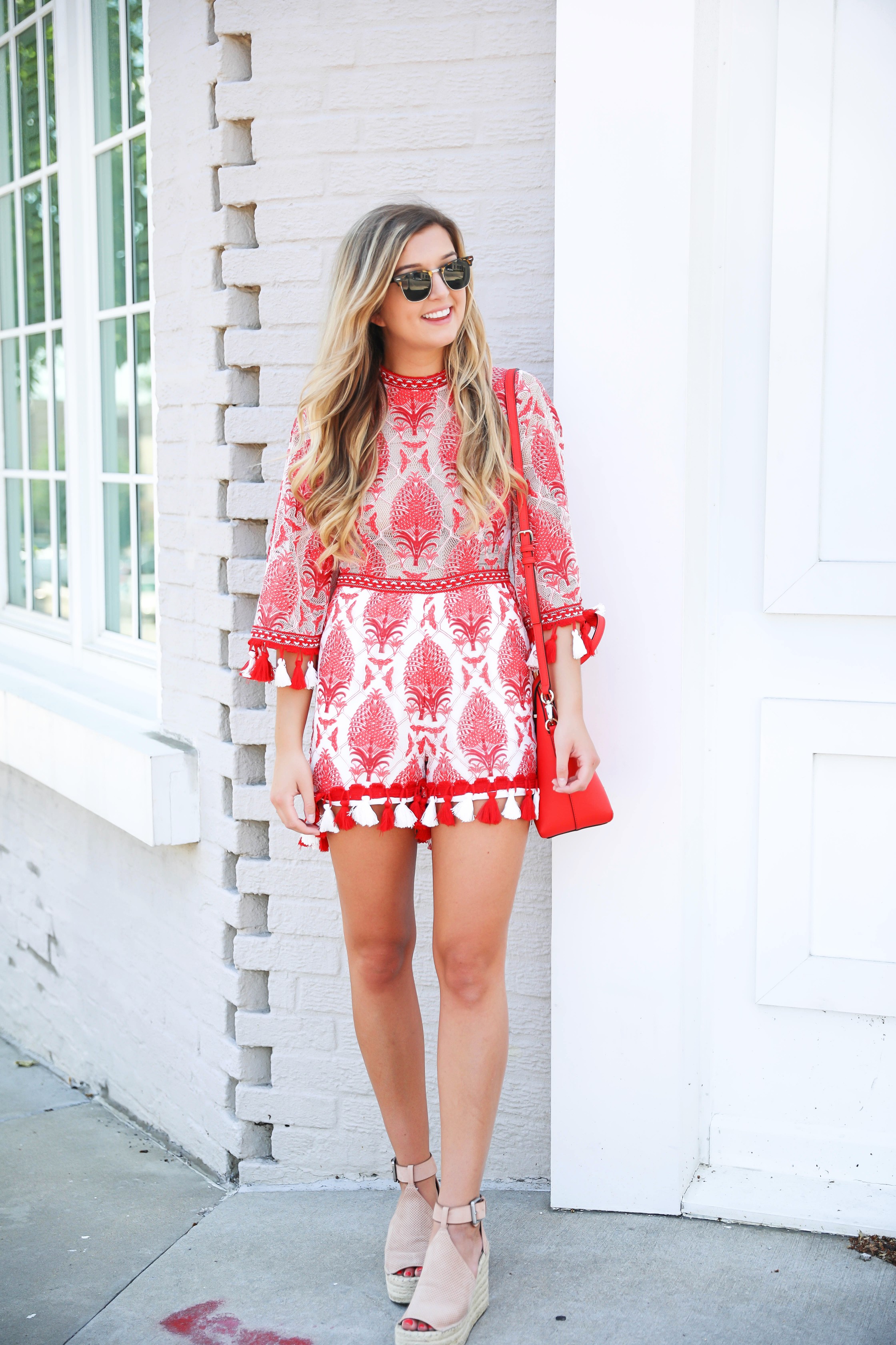 Red and white tassel lace romper from ebay! This is the perfect summer romper, I love the tassels around the sleeves and legs! How cute would this be on the beach? Kate spade red purse styled with this romper! Details on kansas city fashion blog daily dose of charm by lauren lindmark